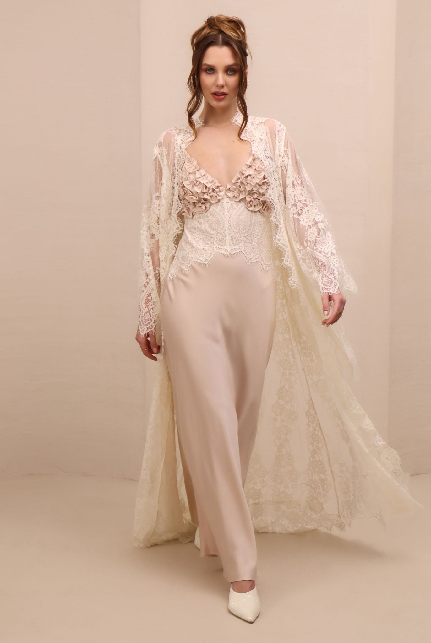 A dynamic motion shot of the Lace Robe and Nightgown Set, capturing the airy movement and the soft back train.