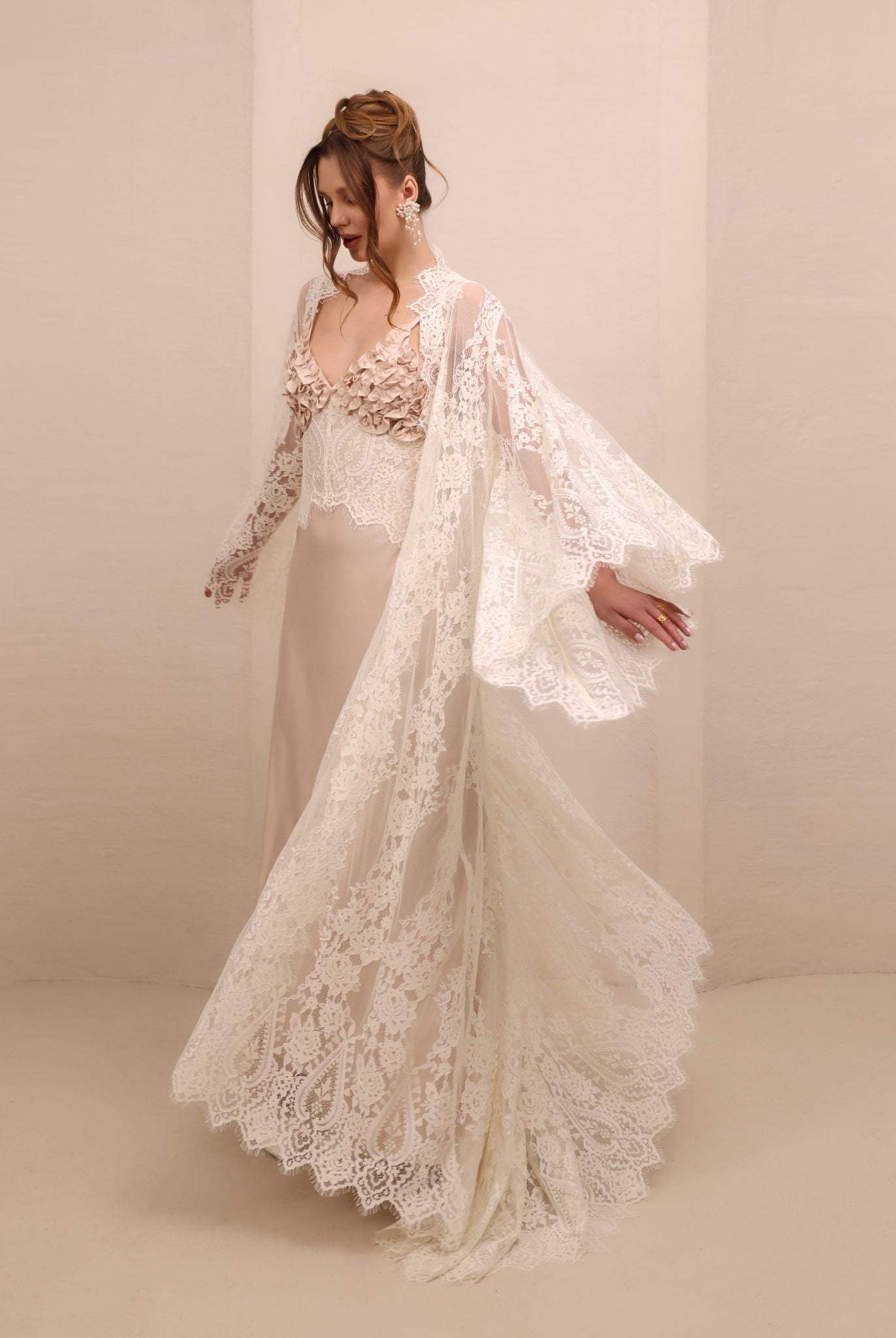 A spirited shot of the Robe and Nightgown Set twirling, capturing the movement of the lightweight lace finish.