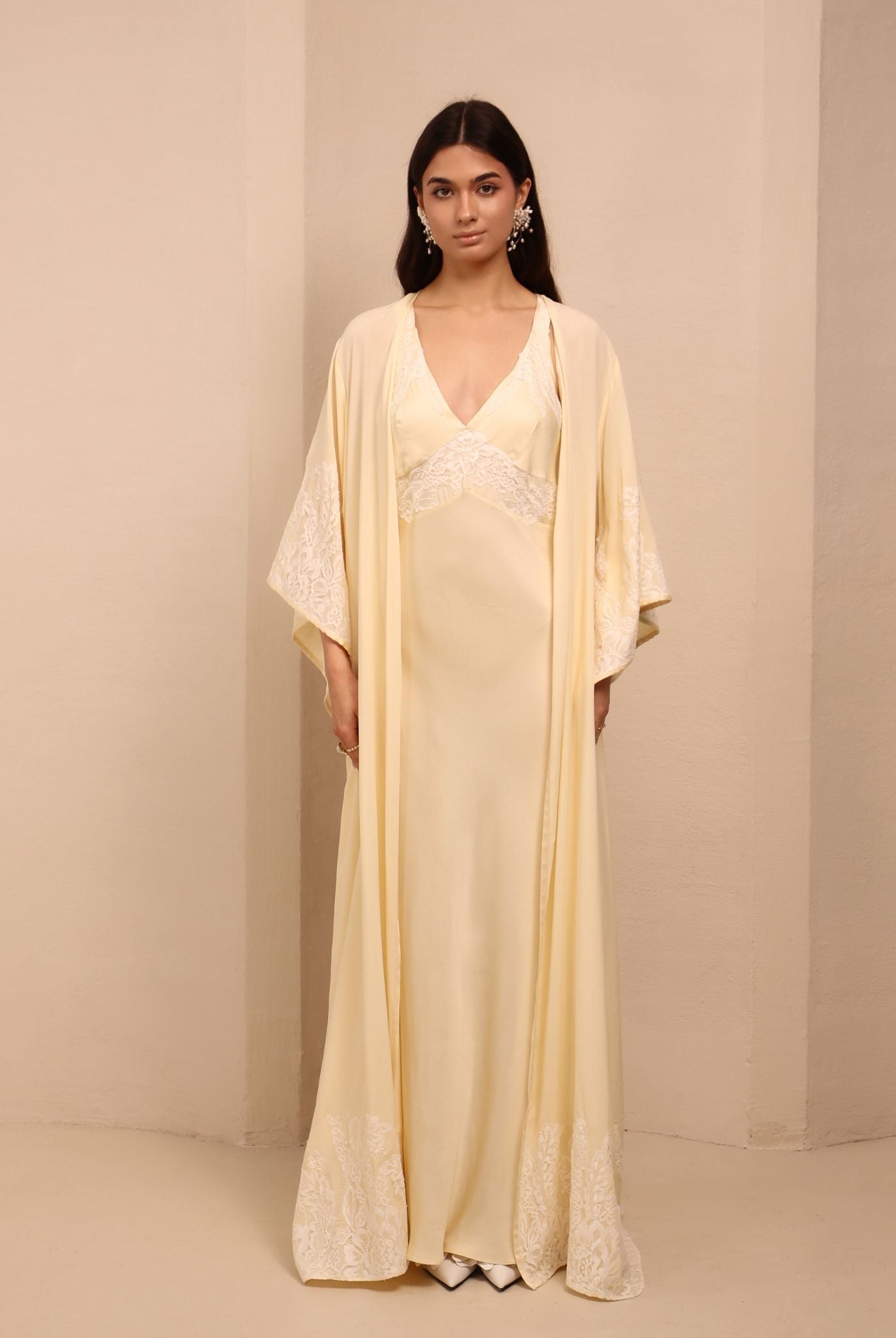 A relaxed view of the open robe, highlighting the floral lace embellishment at the sleeves and edges.