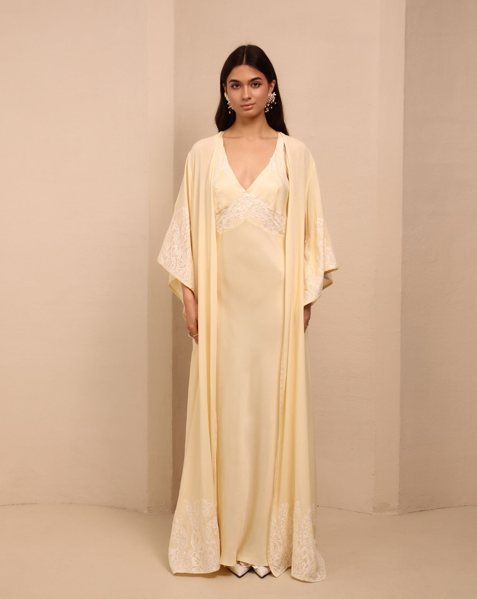 A relaxed view of the open robe, highlighting the floral lace embellishment at the sleeves and edges.