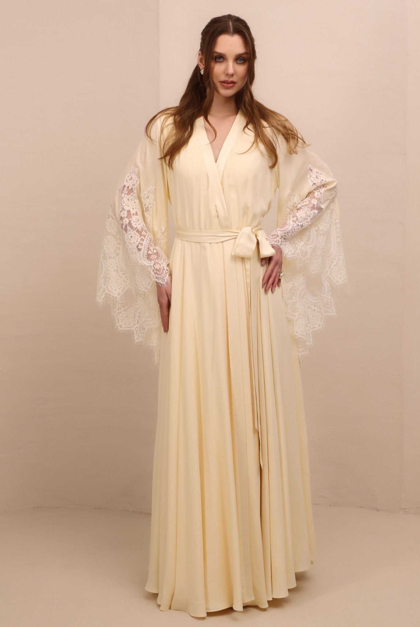 A poised frontal shot of the maternity robe and nightgown set tied with a belt, illustrating a tailored and refined fit.