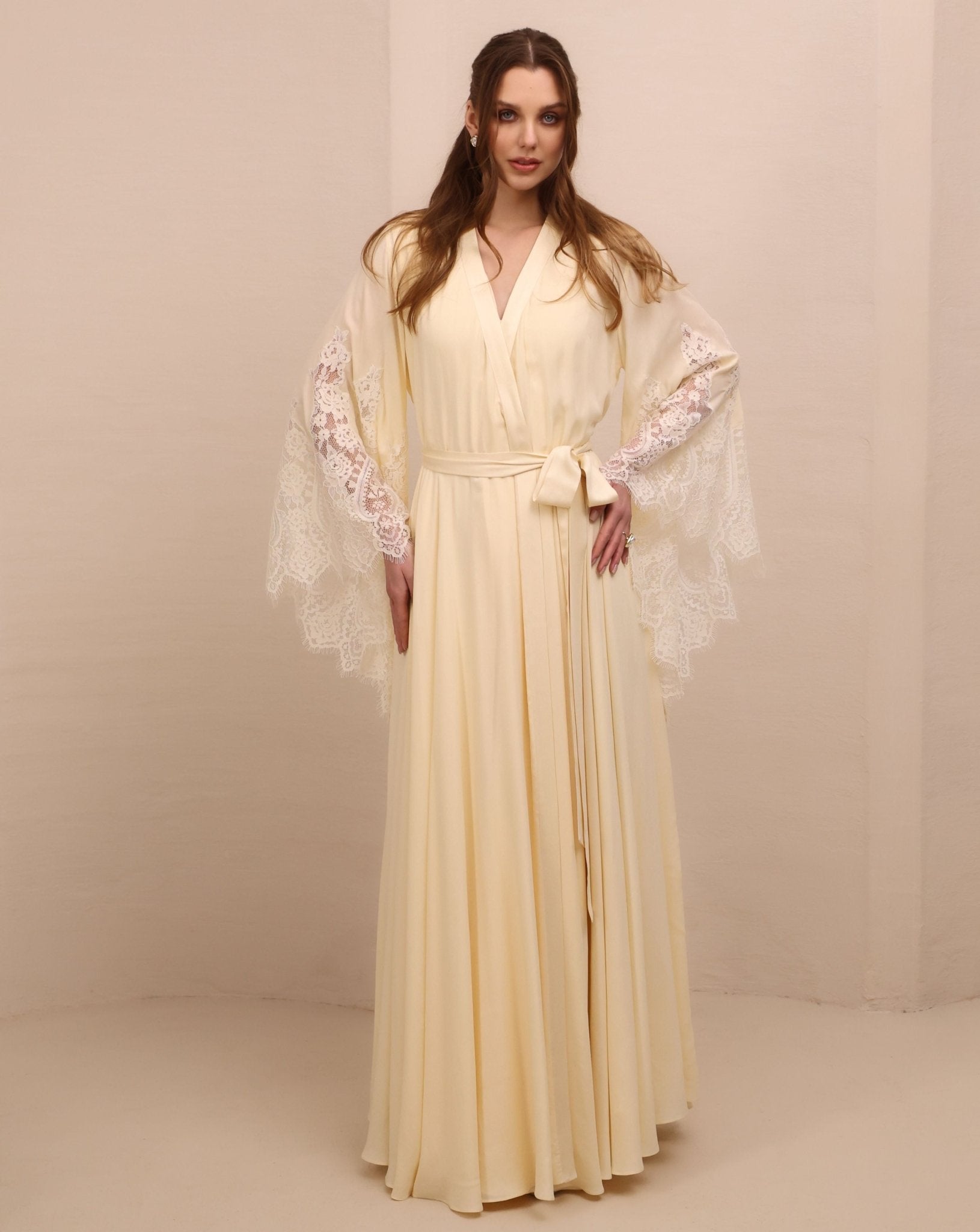 A poised frontal shot of the maternity robe and nightgown set tied with a belt, illustrating a tailored and refined fit.