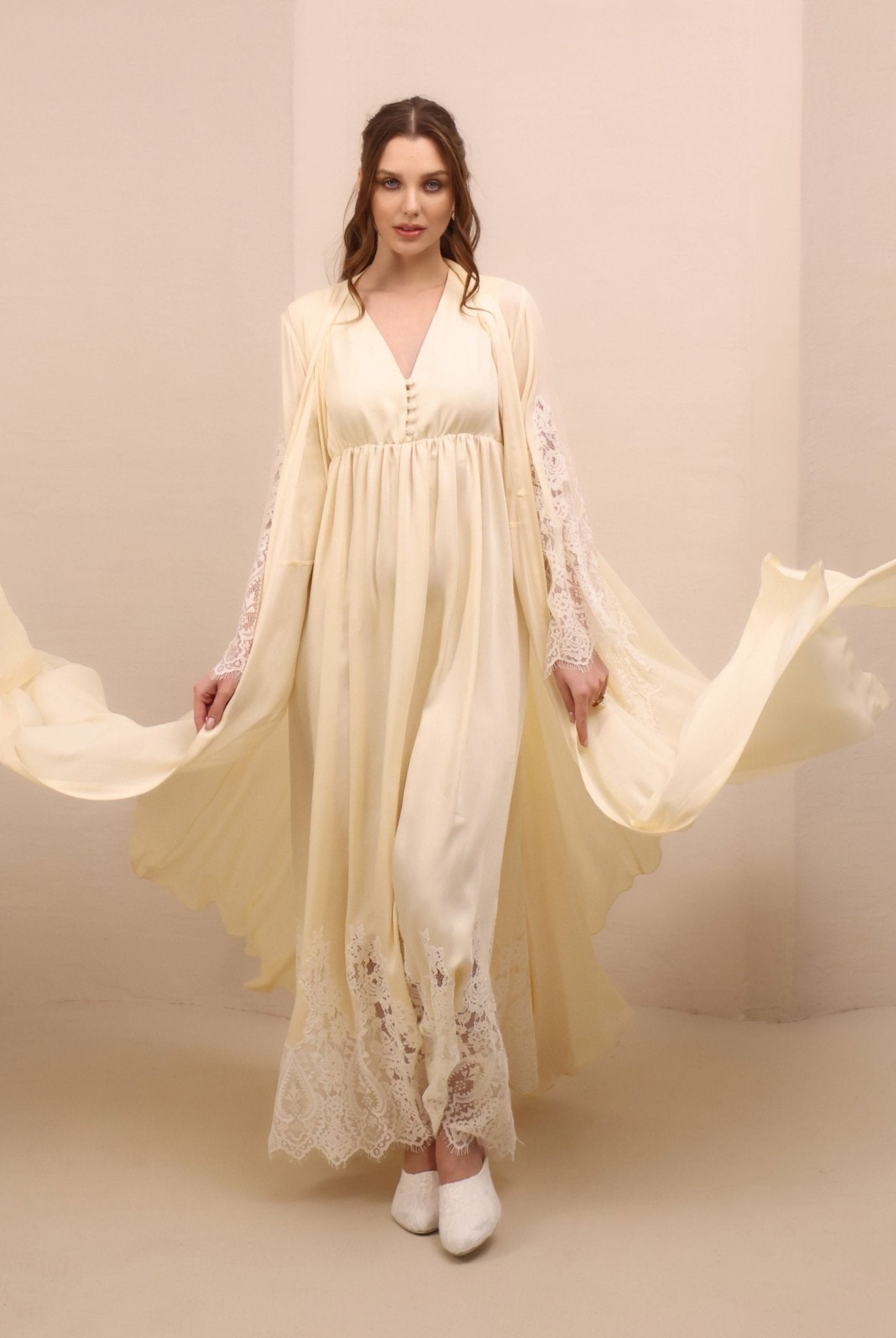 A dynamic view of the maternity robe and nightgown set in motion, capturing the graceful drape of lightweight rayon.