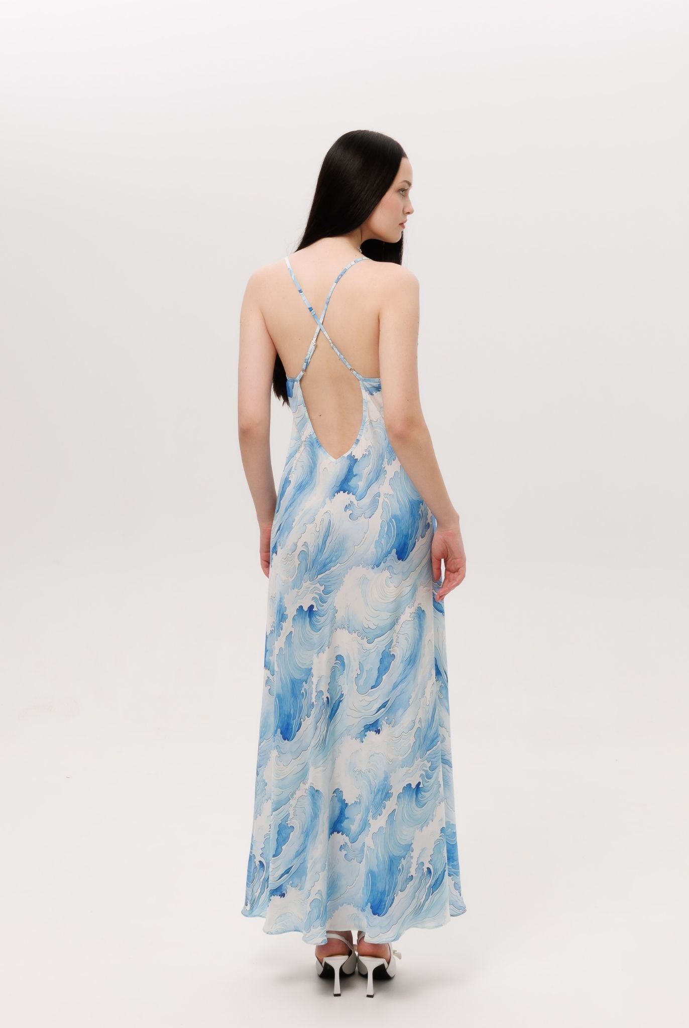 Rear view of the silk nightdress showcasing the mid-open V-cut back and crisscross straps with length regulation.
