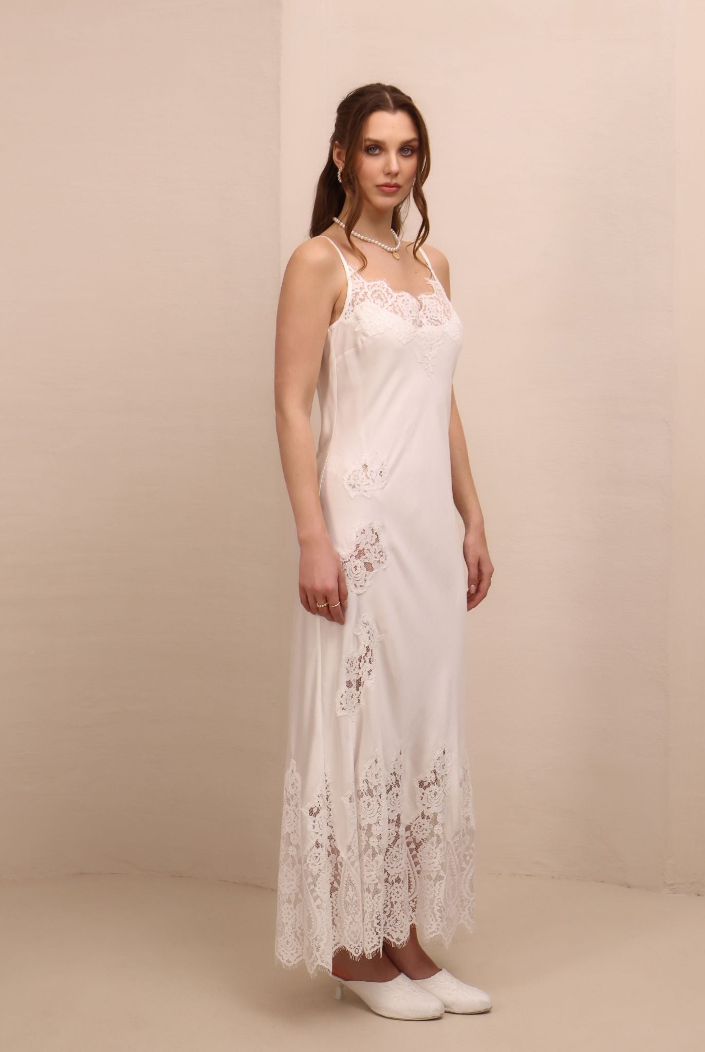 A three-quarter view of the nightgown, focusing on the graceful fit and the airy, feminine design.