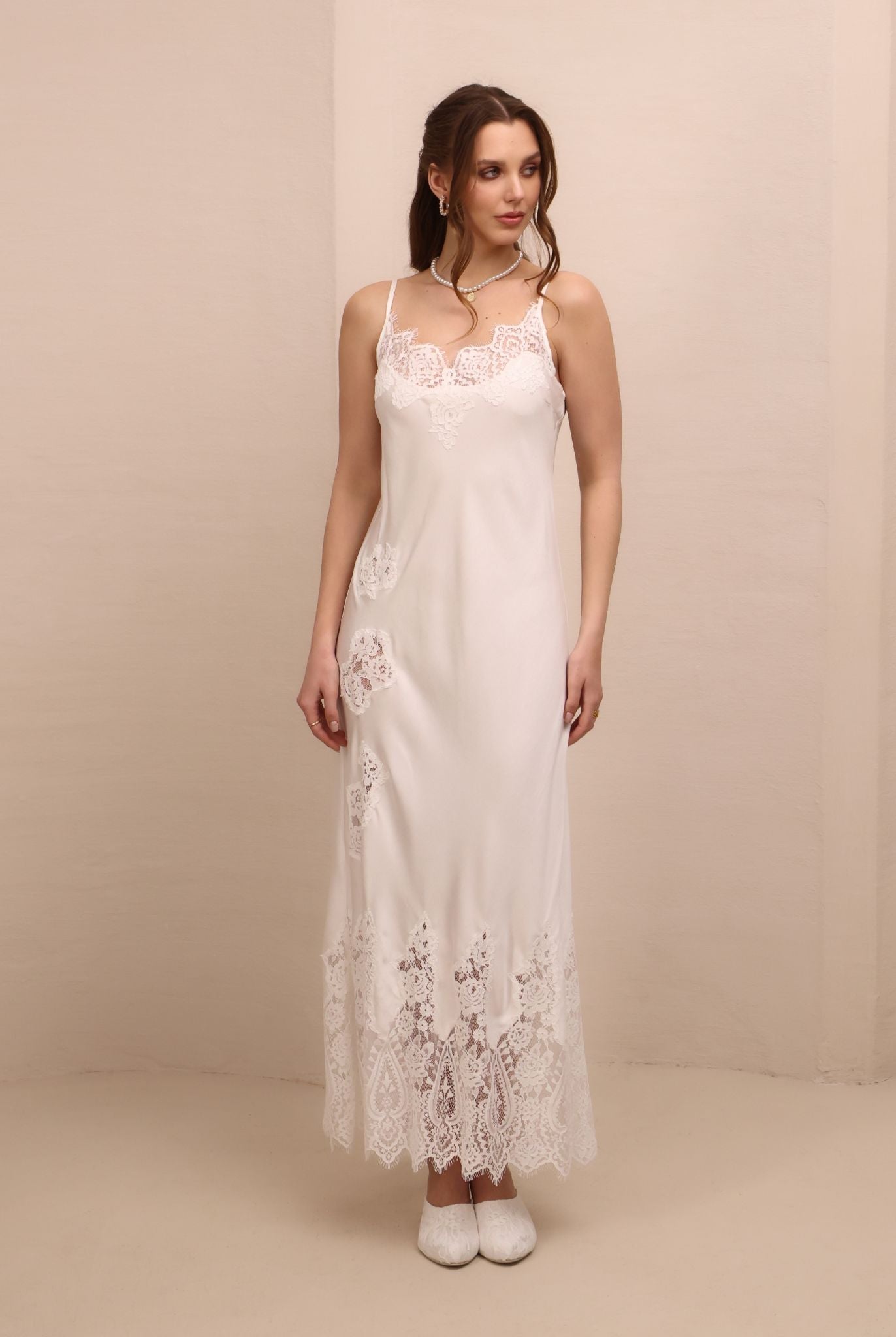 Frontal view of the nightgown featuring delicate lace detailing and adjustable shoulder straps for a perfect fit.