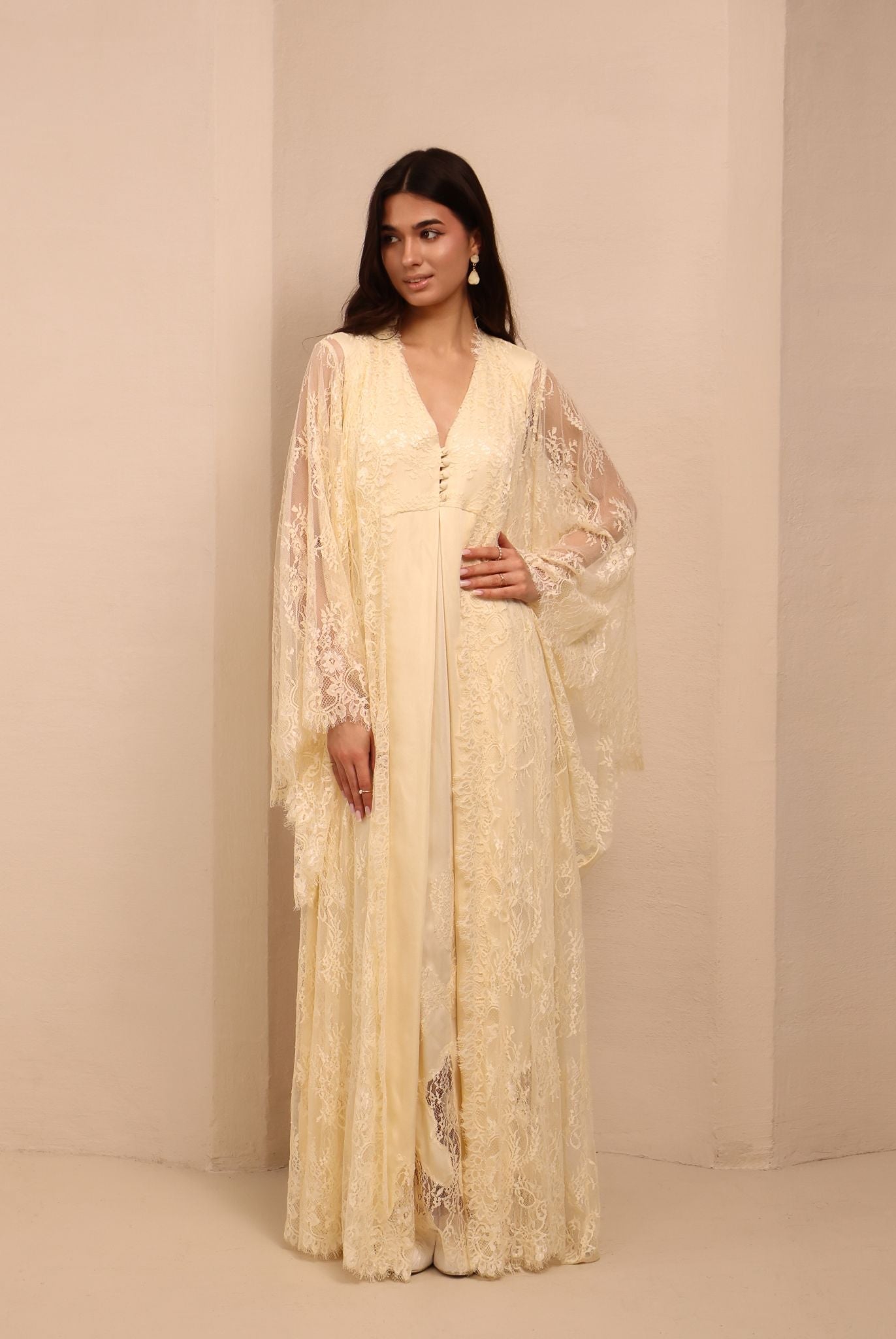 A relaxed view of the open lace robe, capturing a sophisticated look perfect for resting or quiet time with a baby.