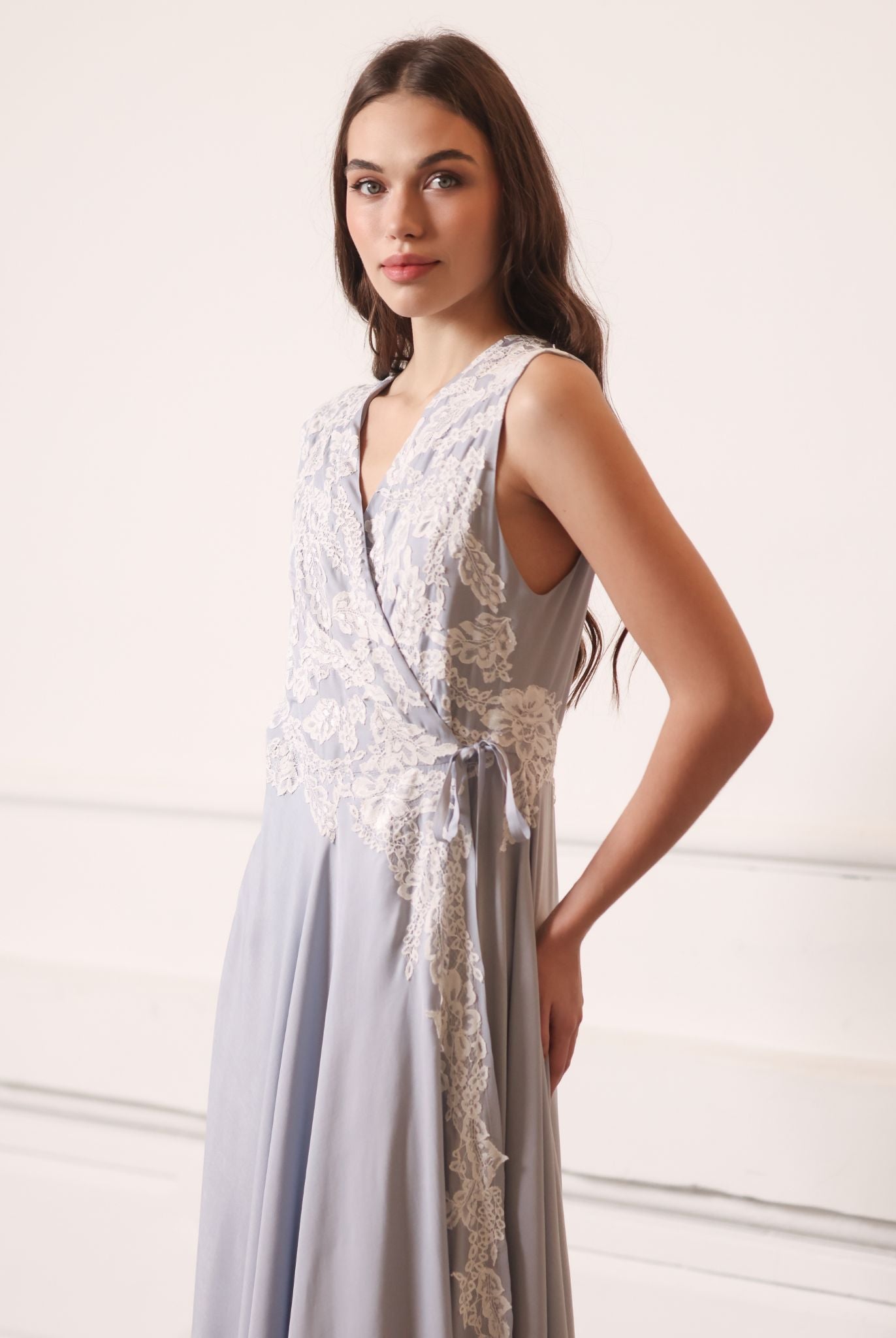 A mid-length view of the nightgown, highlighting the refined floral lacework details along the fabric.
