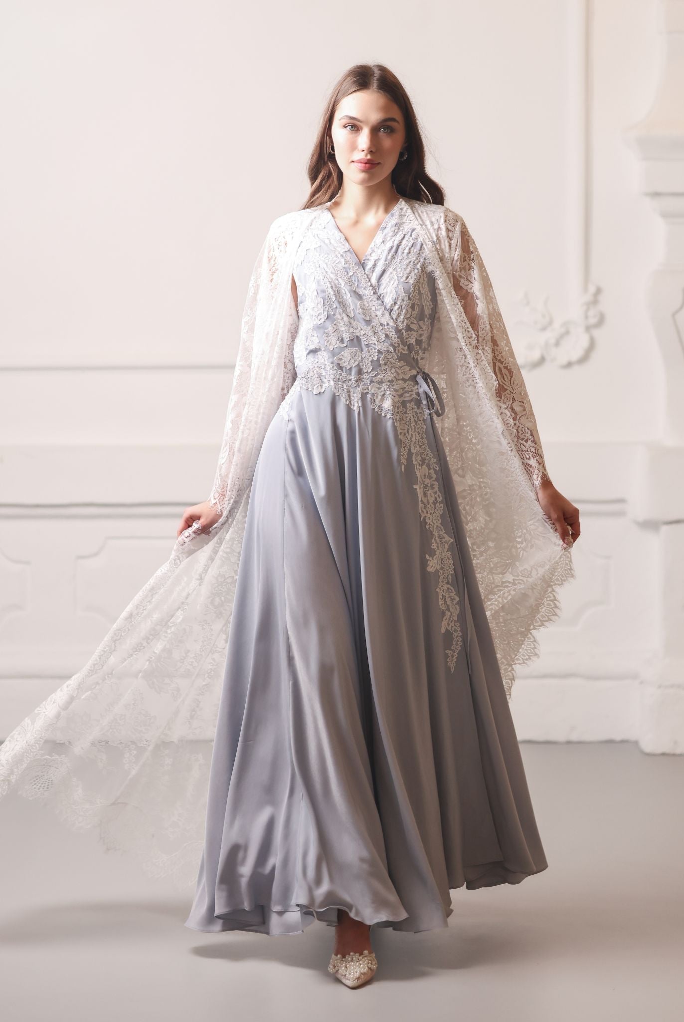 A dynamic motion shot capturing the ensemble as it flows gracefully while the woman walks.