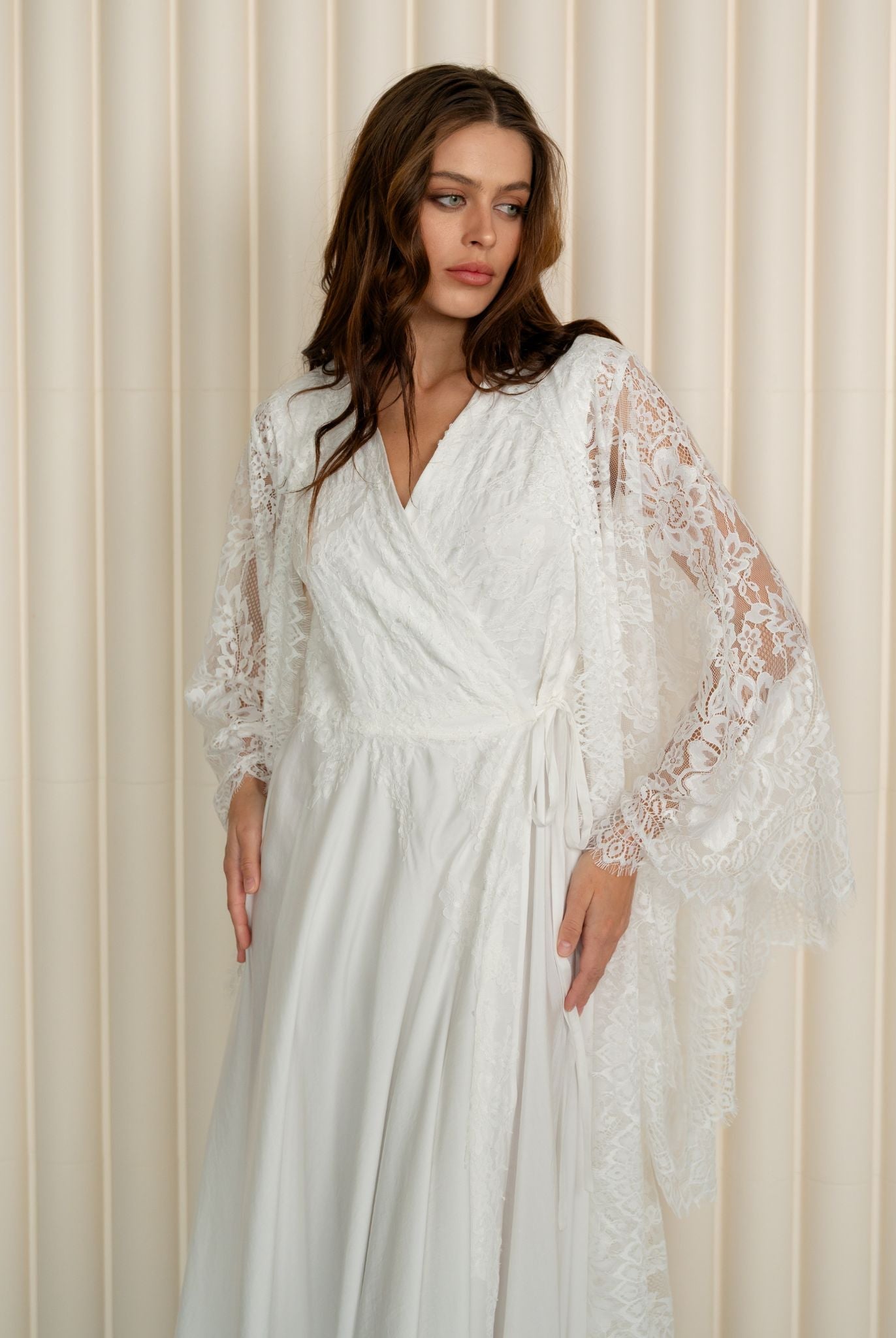 A mid-length shot from head to knees, focusing on the beautiful lines and the graceful flow of the sleeves.