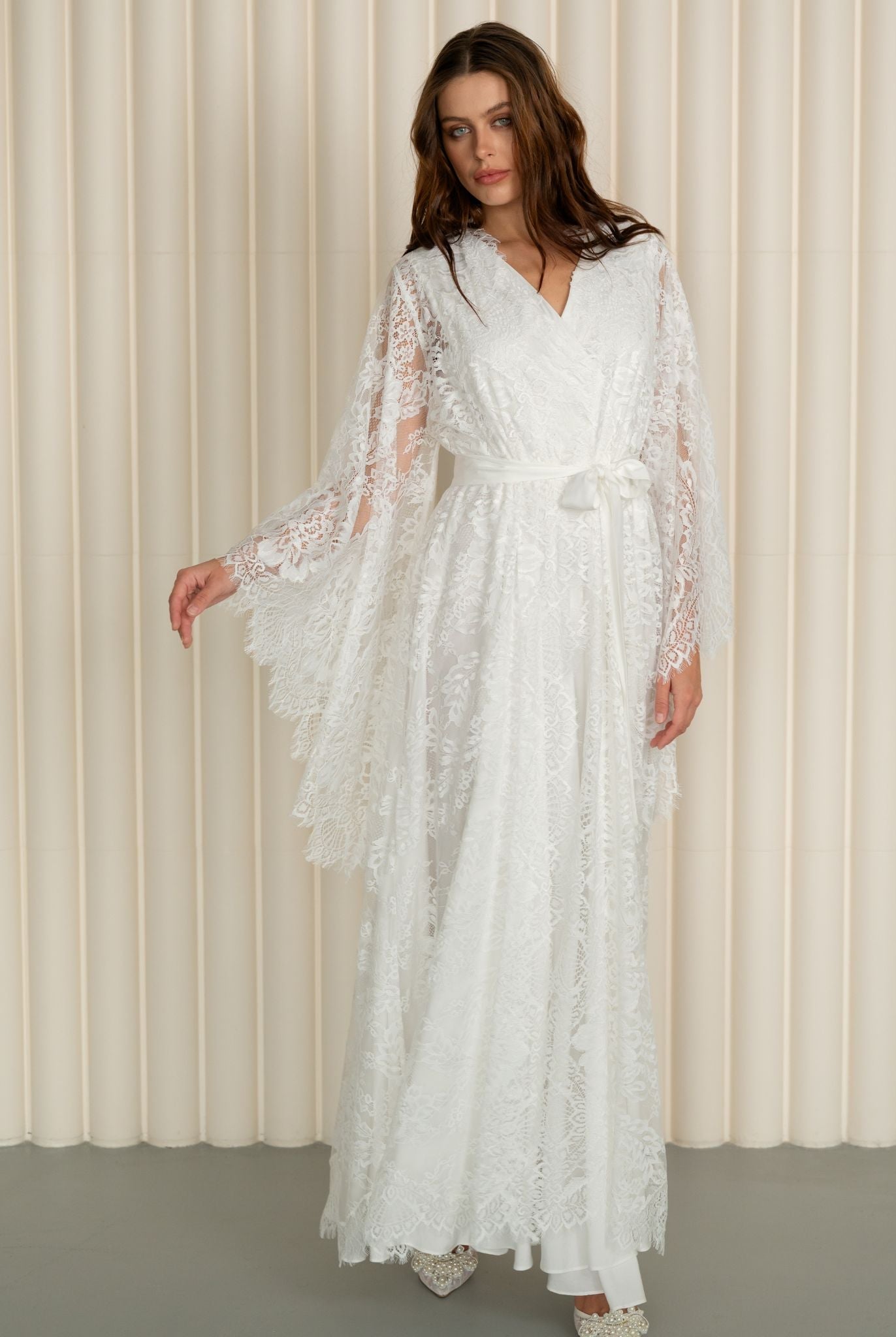 A side-angle view of the woman walking in the wrapped set, showing a natural and comfortable stride.