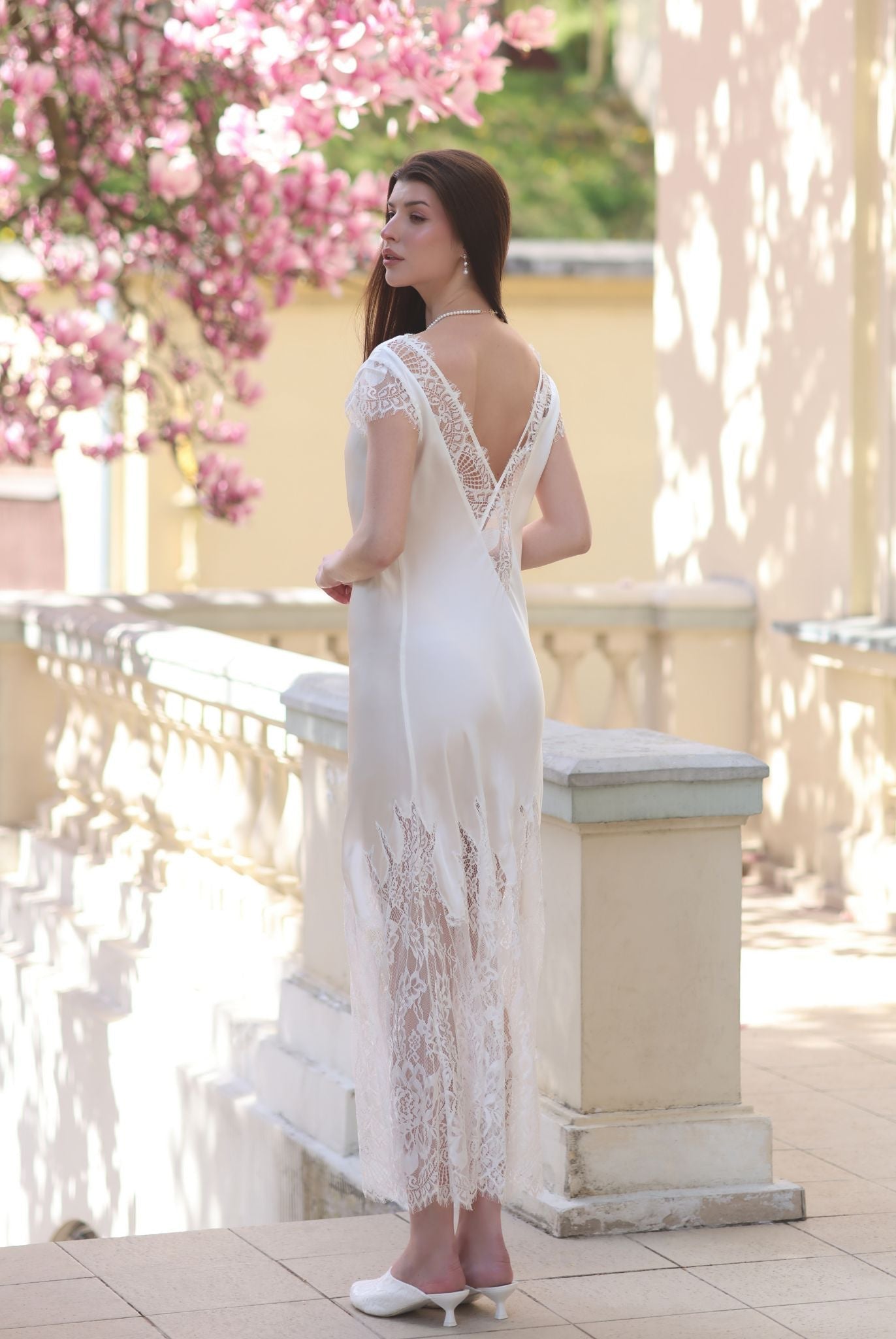 Rear view of the nightgown, showcasing the stunning lace insert and delicate cap sleeves.
