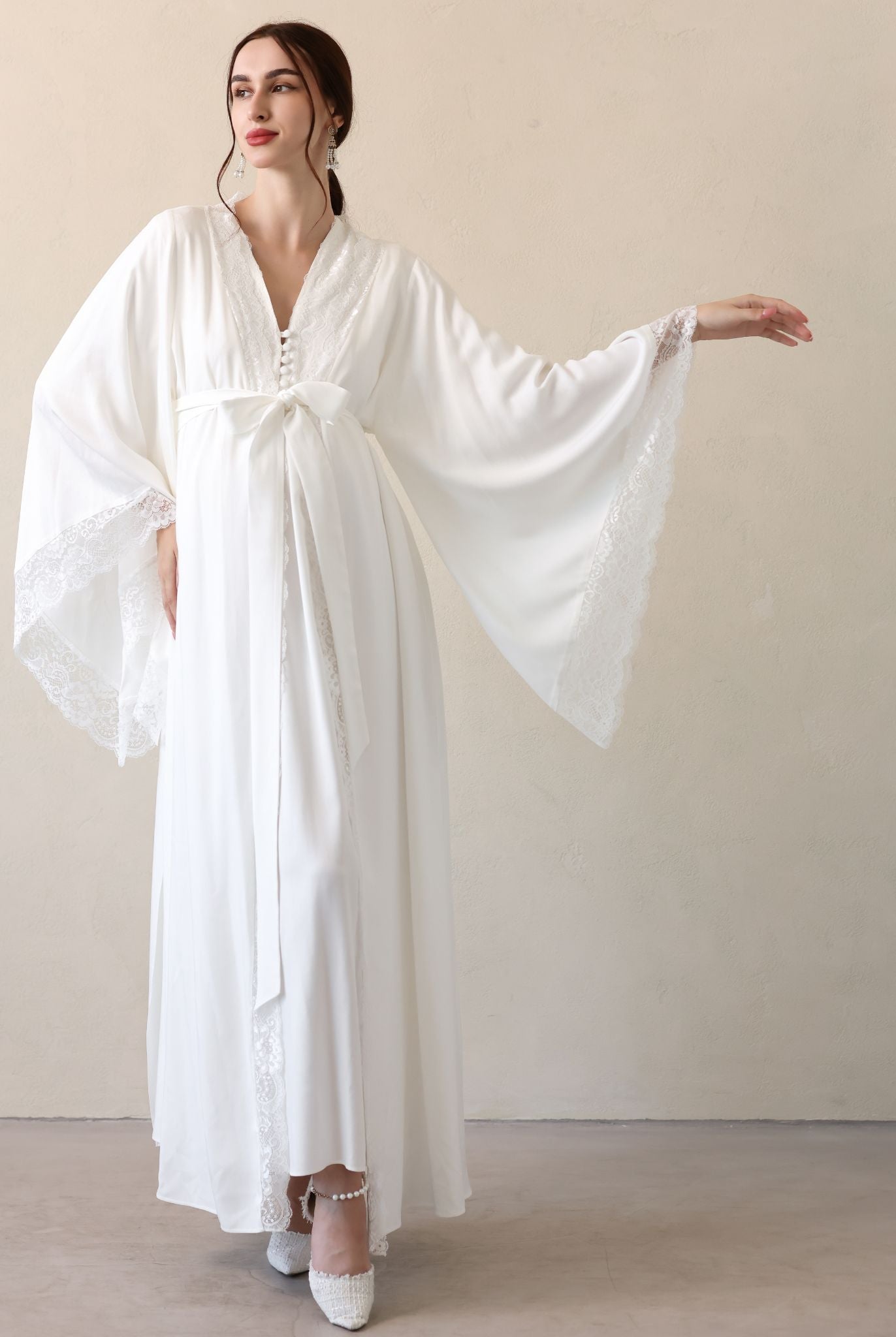 Frontal view with one arm extended to highlight the lace detailing and the reliable, high-quality material.