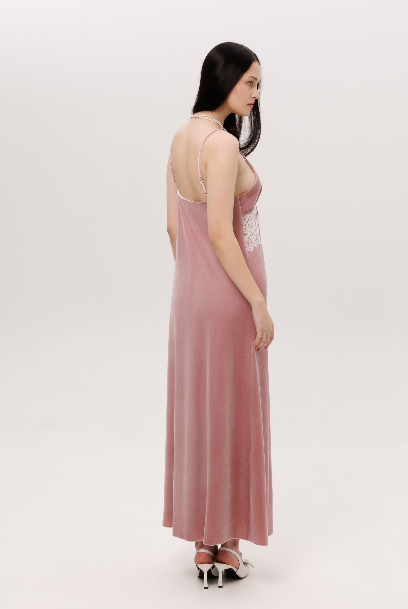 Side perspective of the long nightdress, illustrating the graceful weight and effortless grandeur.