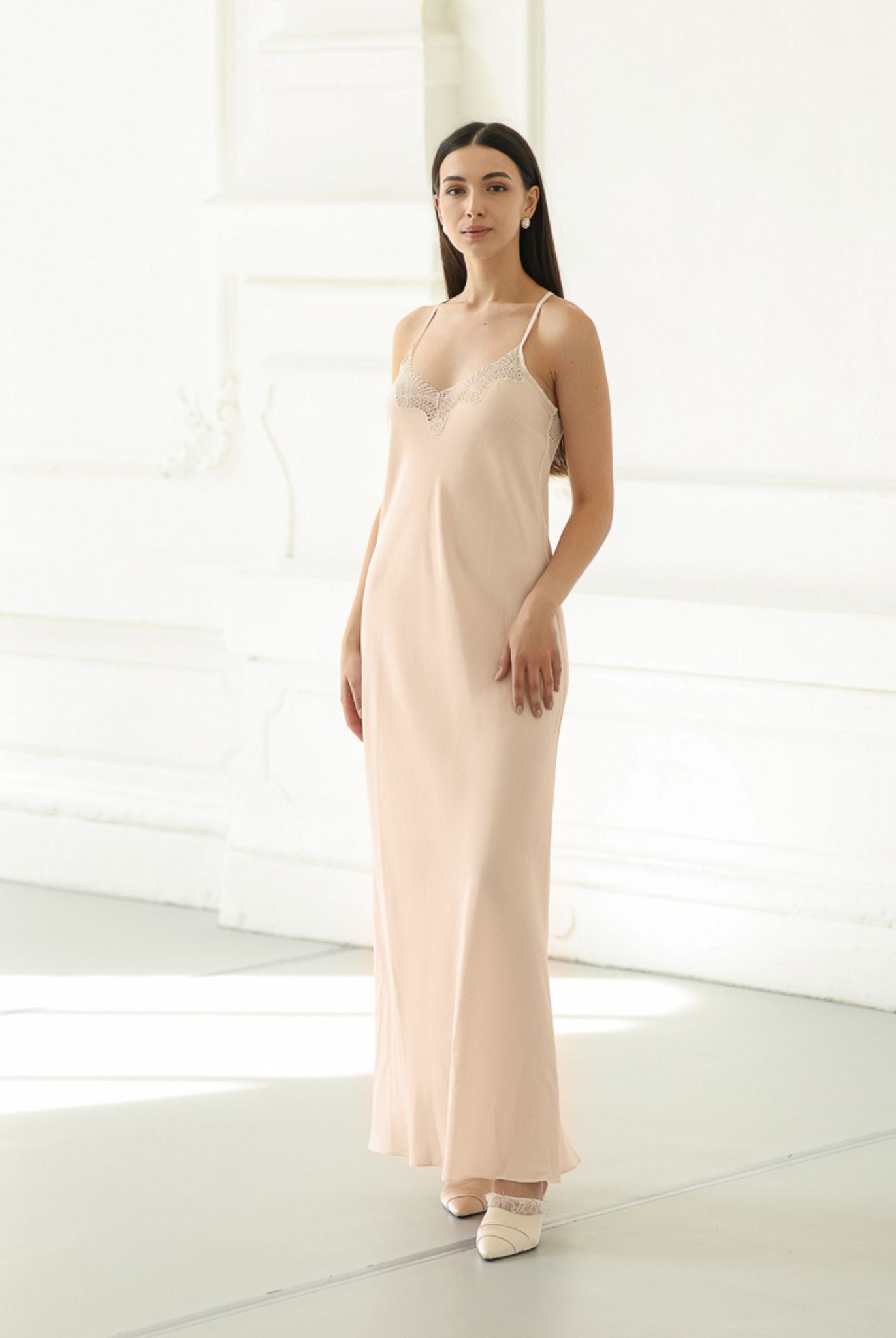 Frontal full-length view of a cotton-blend nightgown, featuring a breathable fabric and a graceful, flattering silhouette.