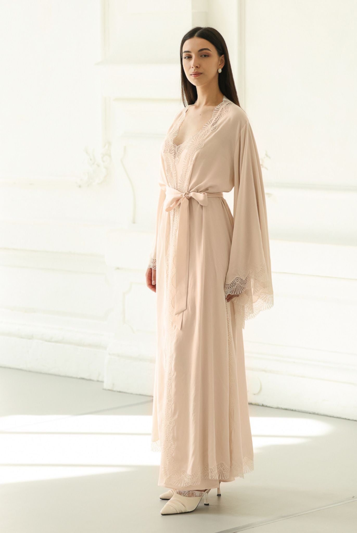 Frontal view of the belted wrap-over robe, illustrating a graceful silhouette that moves effortlessly with the body.