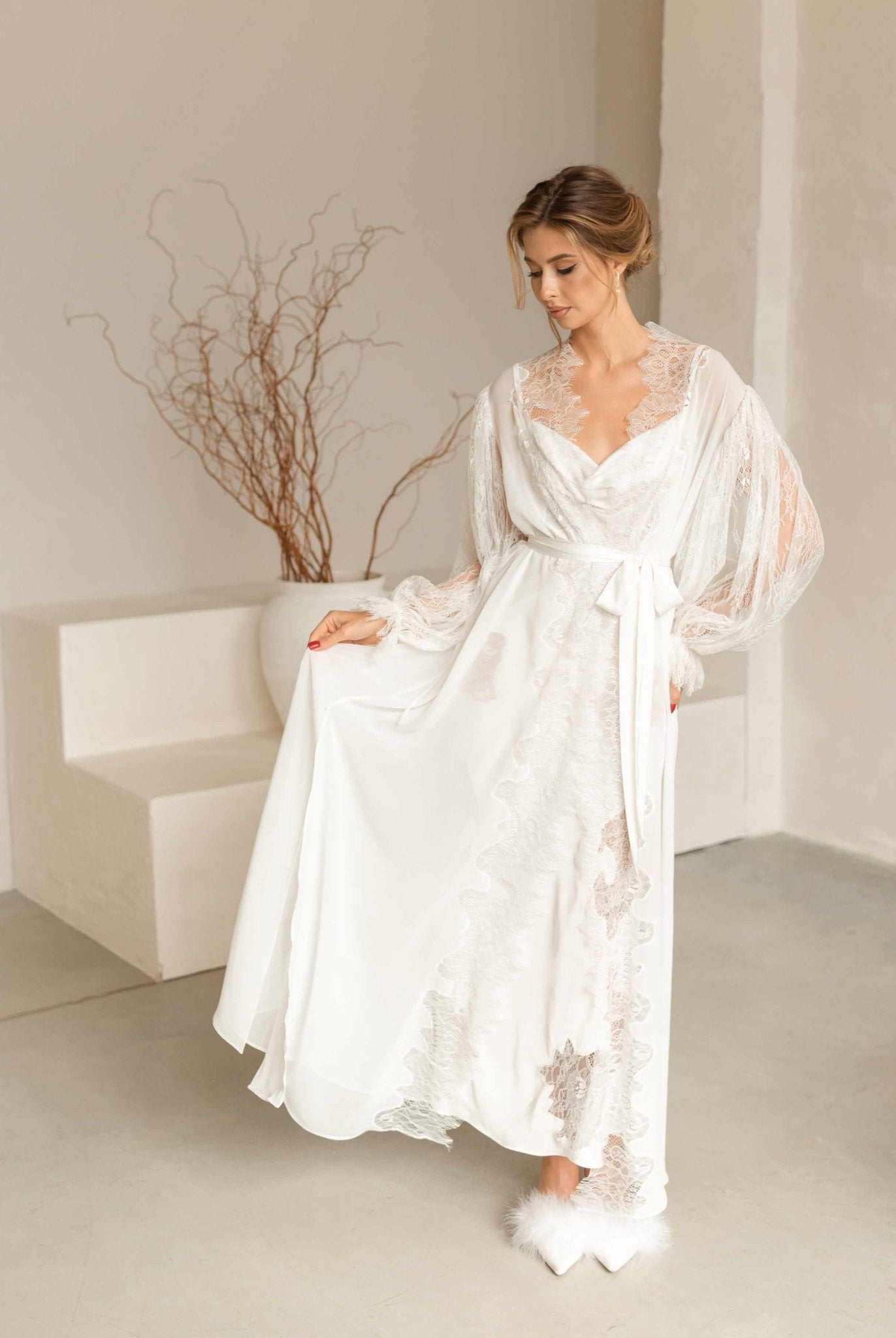 Model in the Peony set gracefully lifting the edge of the airy chiffon robe to show the delicate lace trim.