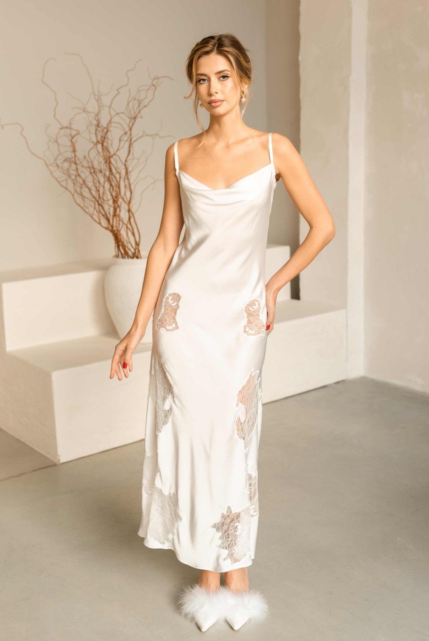 Full-length view of the white lace nightgown from the Bridal Robe and Nightgown Set, showing its feminine silhouette.