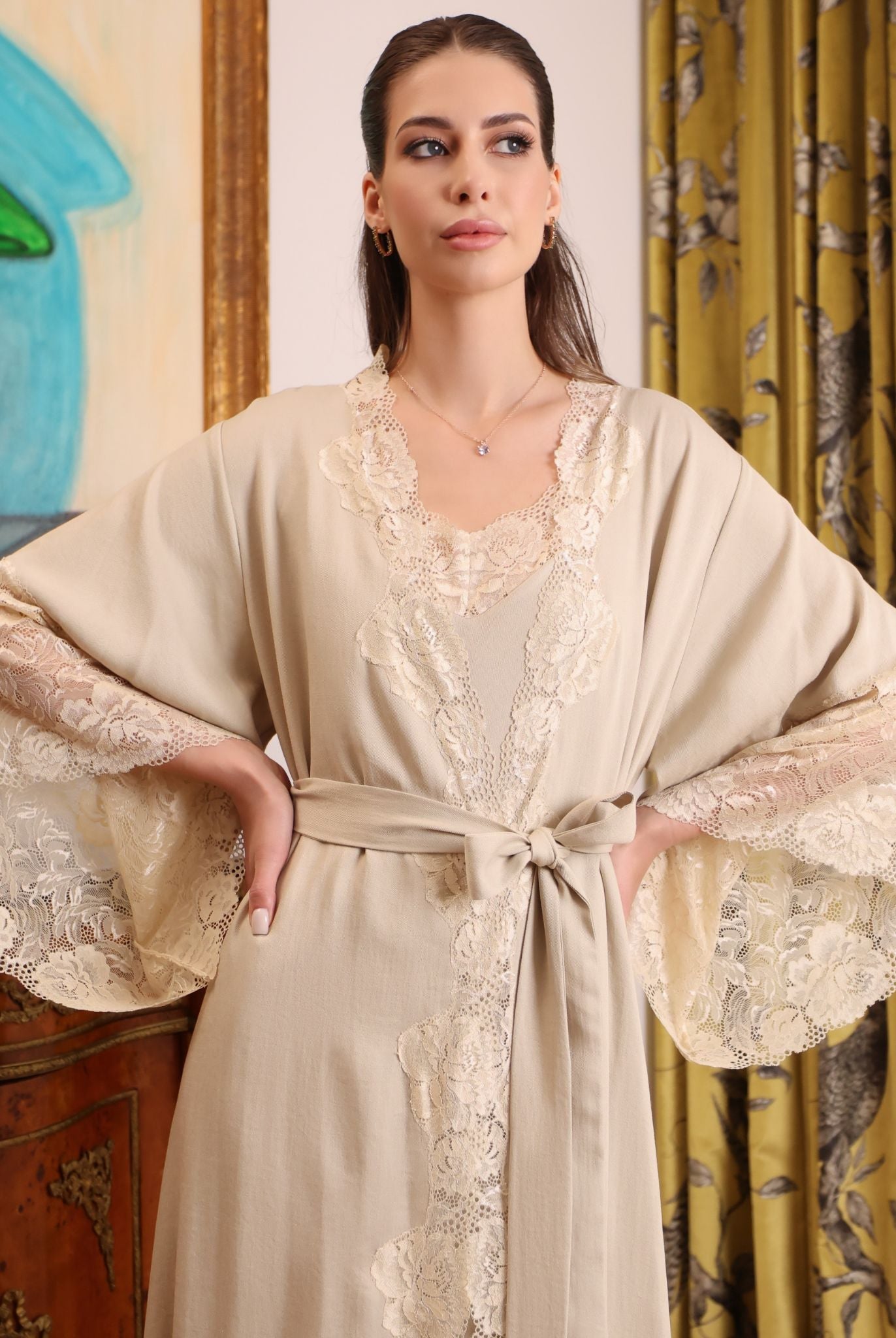 Mid-length shot of the Cotton Robe with a sash tie, emphasizing the defined waist and architectural lace details.