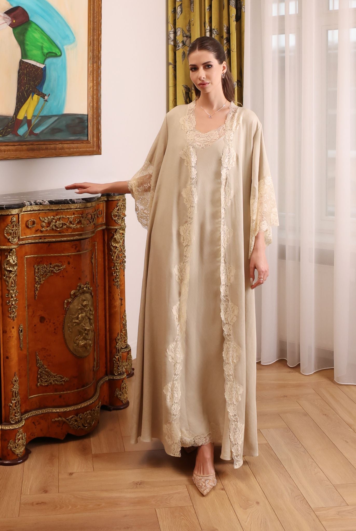 A poised shot of the Cotton Robe set by a bedside table, illustrating timeless elegance and grounded comfort.