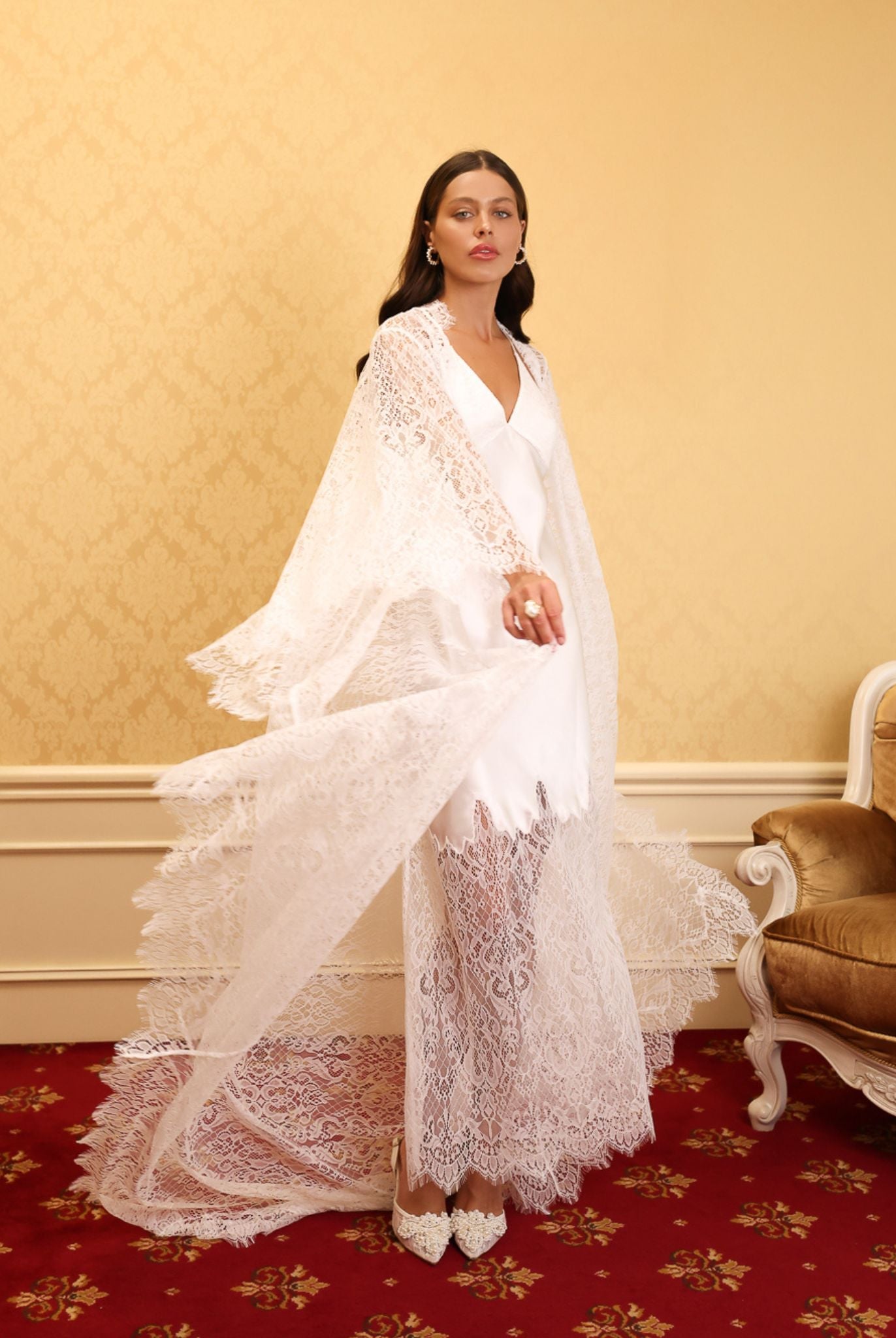 White Bridal Robe and Nightgown Set in motion, featuring flowing French lace and a radiant silk satin glow.