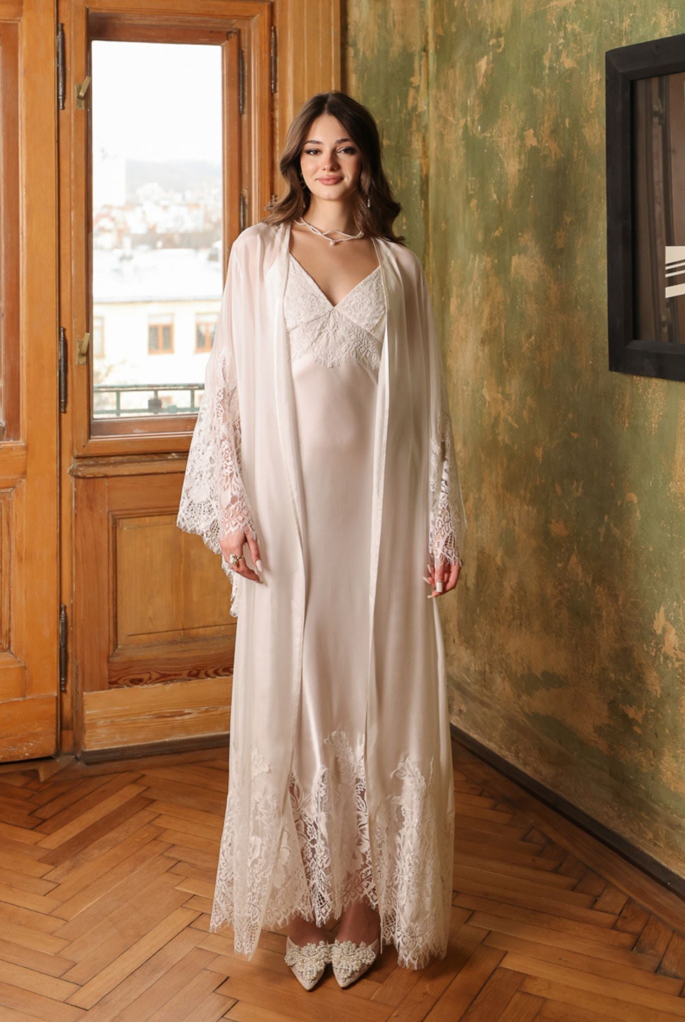 Static front view of the white silk ensemble, emphasizing the minimalist elegance and premium fabric quality.