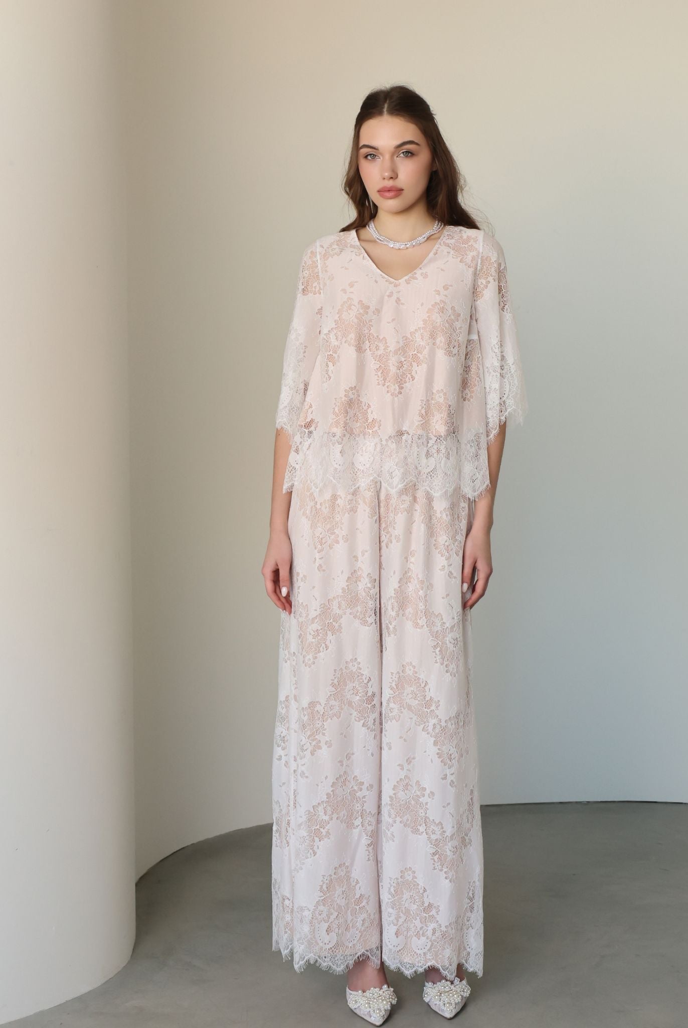 A poised frontal view of the set, highlighting the lightweight cotton fabric and delicate lace layer.
