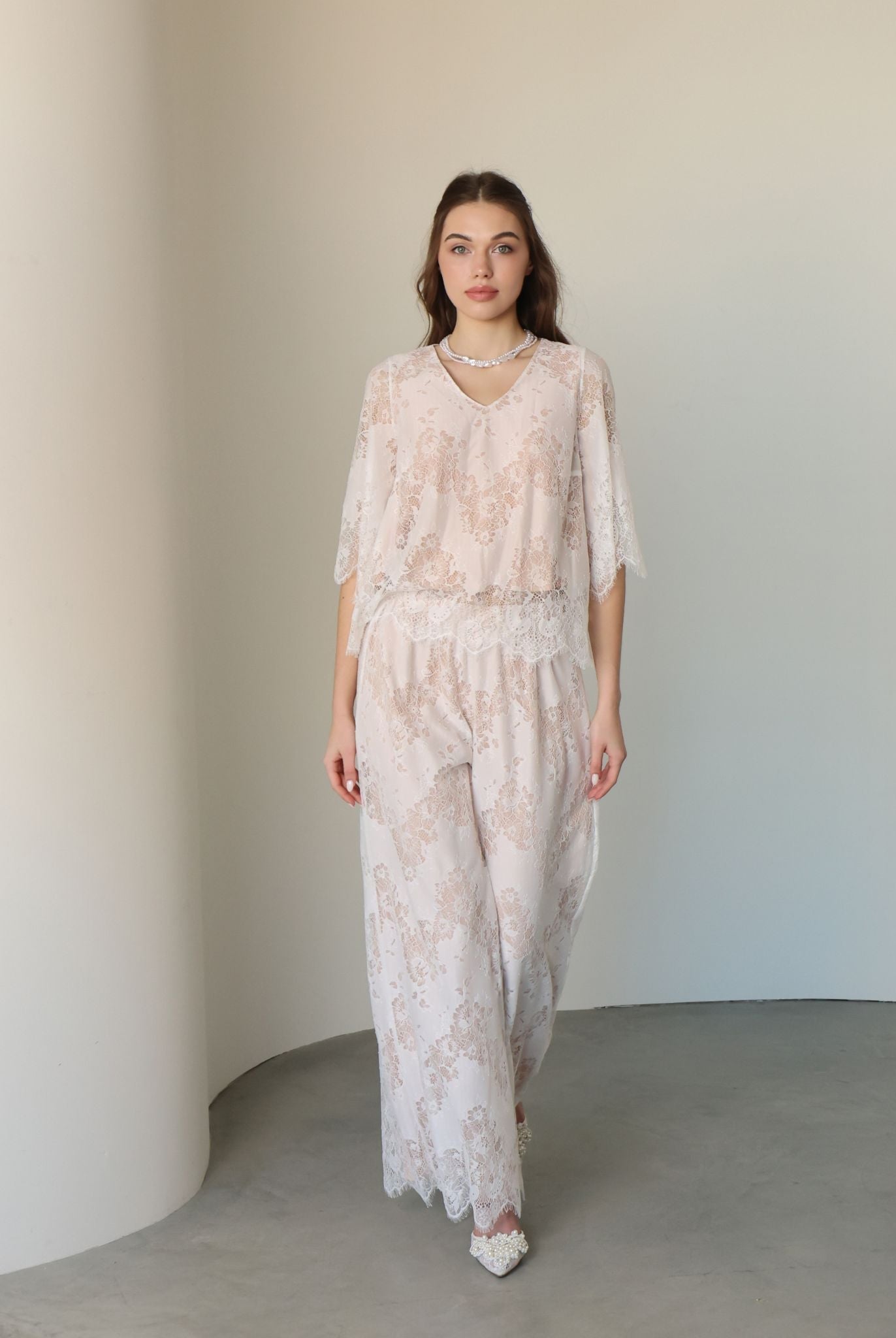 A full-length motion shot of the Cotton Pyjamas, showcasing the gentle drape and refined silhouette.