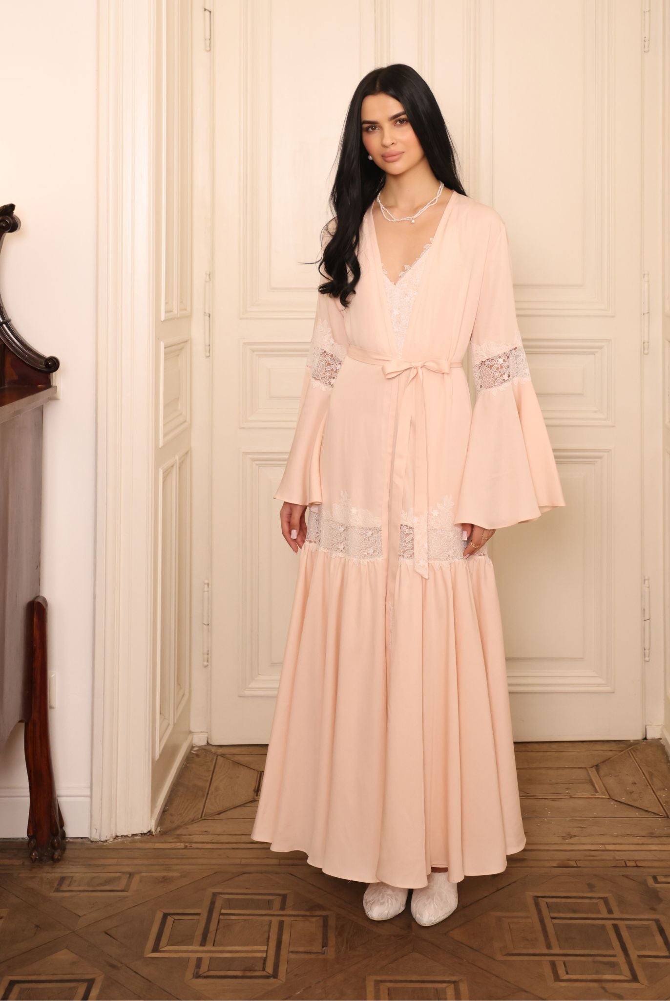 A static full-length shot capturing the refined beauty and quiet confidence of the two-piece ensemble.