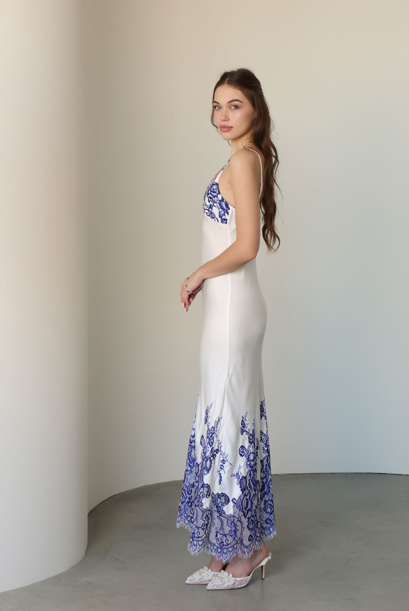 Side perspective of the sleeveless nightgown, highlighting the natural softness and simple, elegant lines.