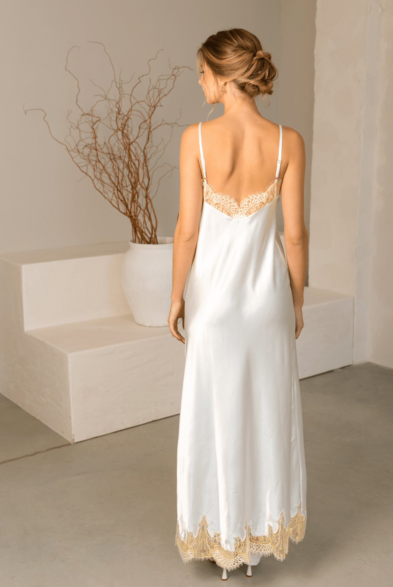 Rear view of the nightgown from the Robe and Nightgown Set, showing the smooth fabric and lace hem.