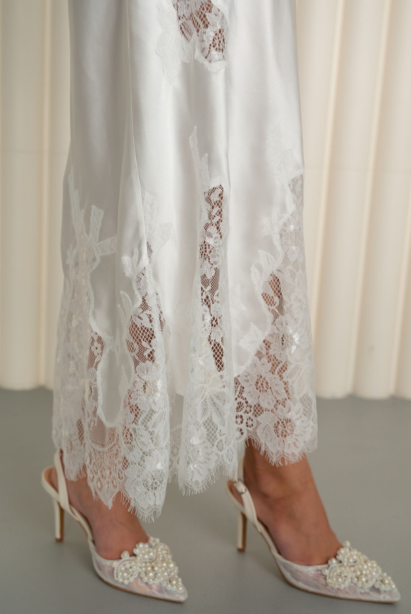 Detailed view of lace embroidery on silk nightgown by Kafemme