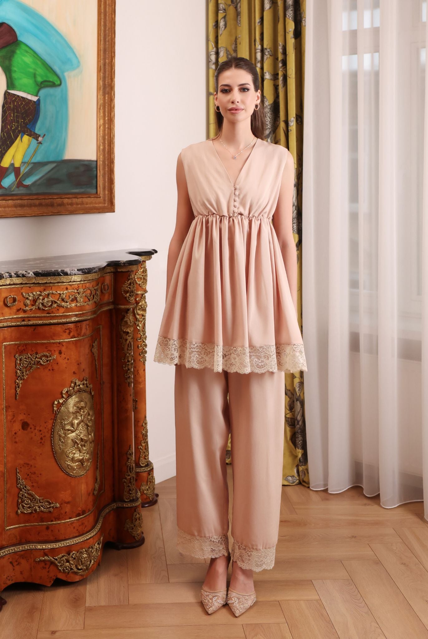 Front view of the pajama trousers and top, featuring soft elastic under the bust and delicate lace embellishments.