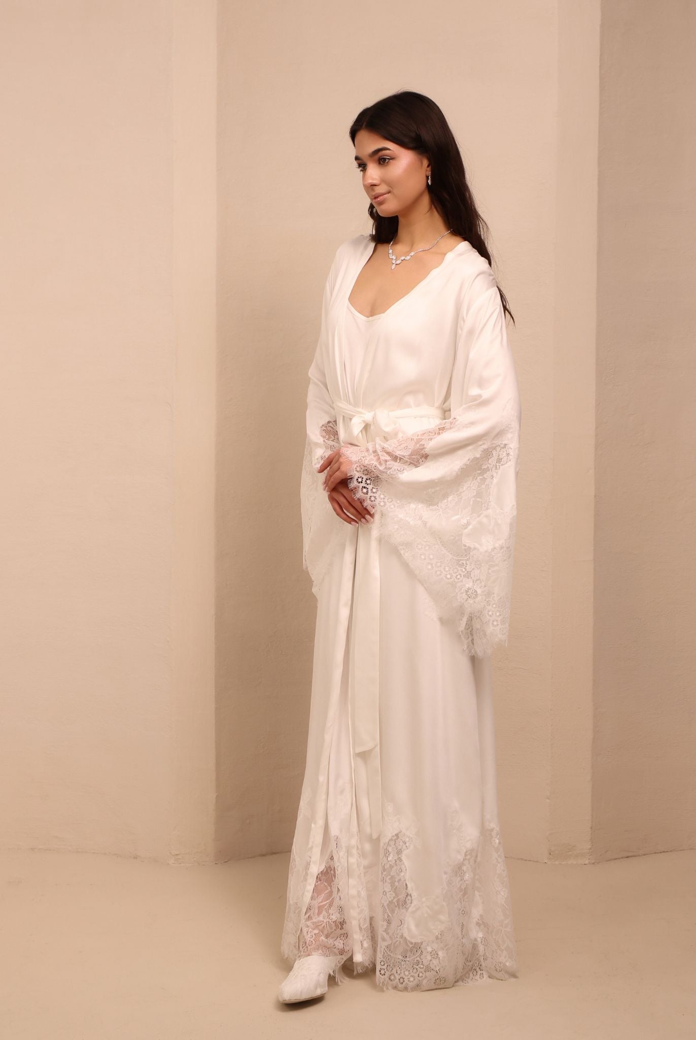 A dynamic shot of the white Robe and Nightgown Set in motion, balancing functionality with romantic beauty.