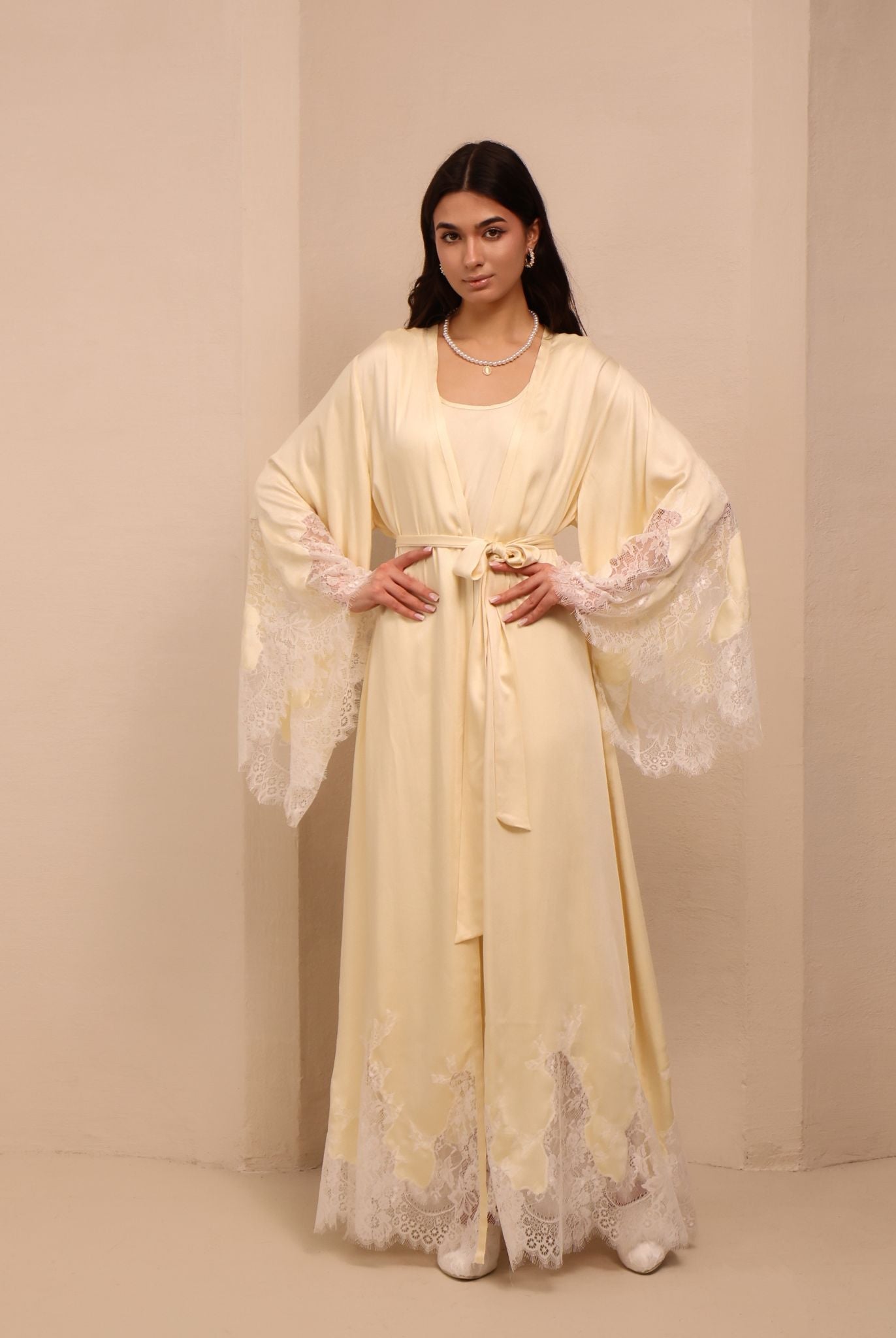 A poised shot of the tied nightgown, showcasing the flattering fit that adapts as the body changes.