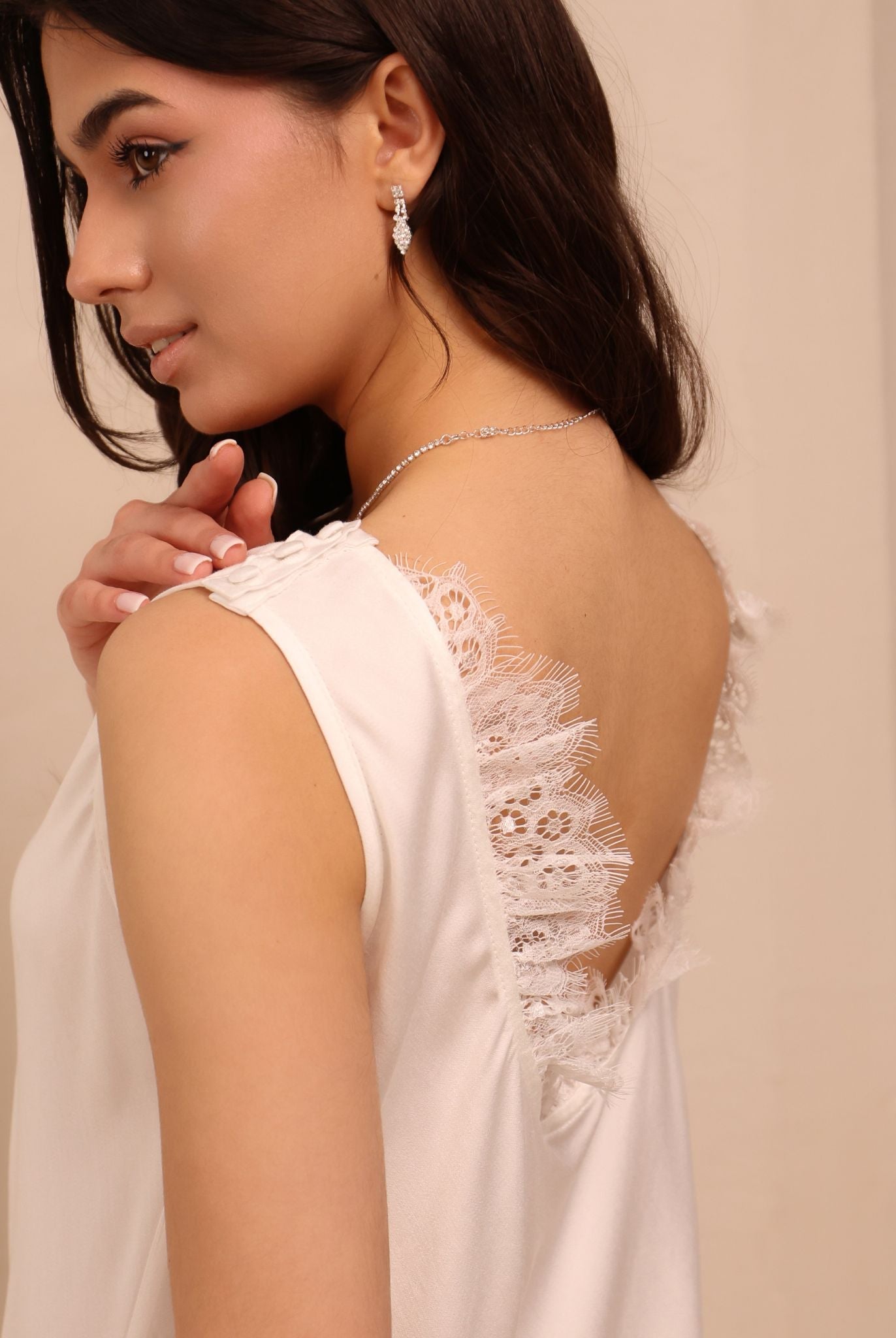 A close-up side shot of the white nightgown, focusing on the soft, breathable fabric and feminine silhouette.