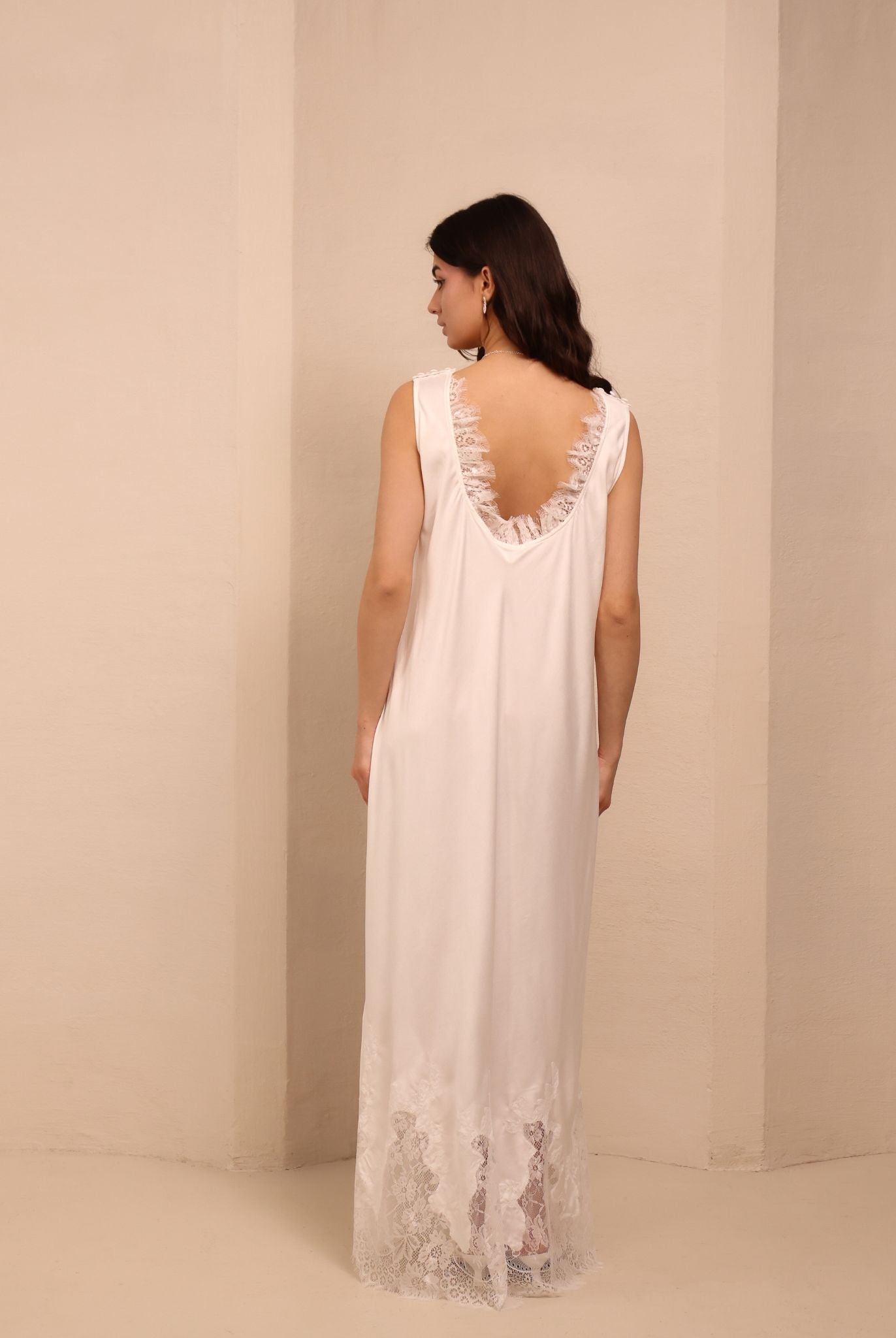 A final rear view of the white nightdress, highlighting the clean look and natural softness of the material.