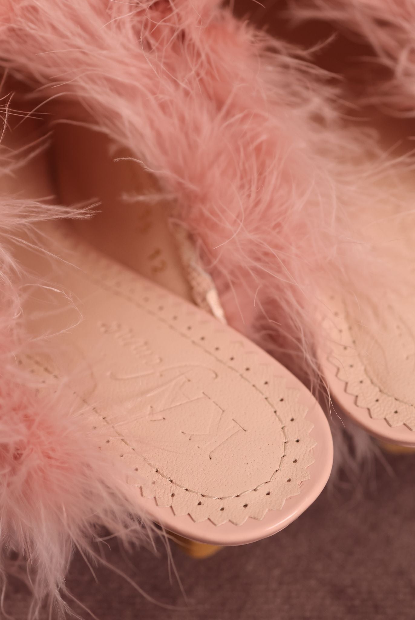 Detailed shot of the KÂfemme logo on the Heeled Slippers, capturing the quiet luxury and refined design.