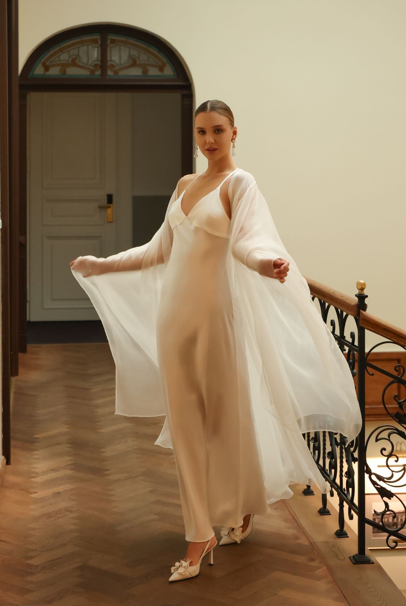 Close-up of the exceptionally long and flowing sleeves of the bridal silk wrap, made from 100% mulberry silk.