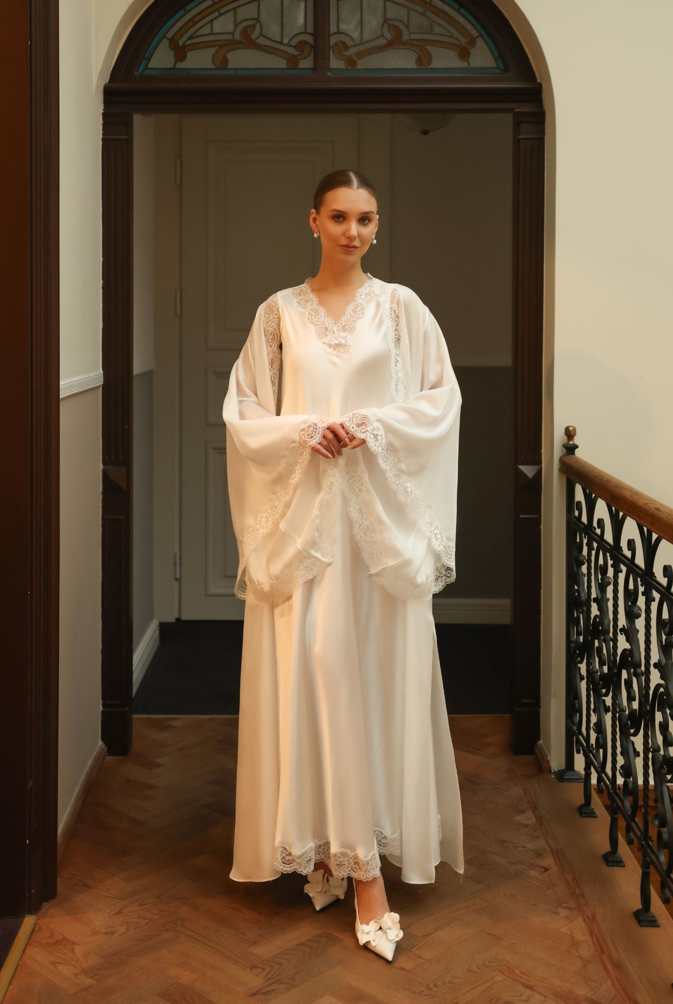 Silk Robe and Nightgown Set with hands held together to display the exquisite wide sleeves trimmed with fine lace.