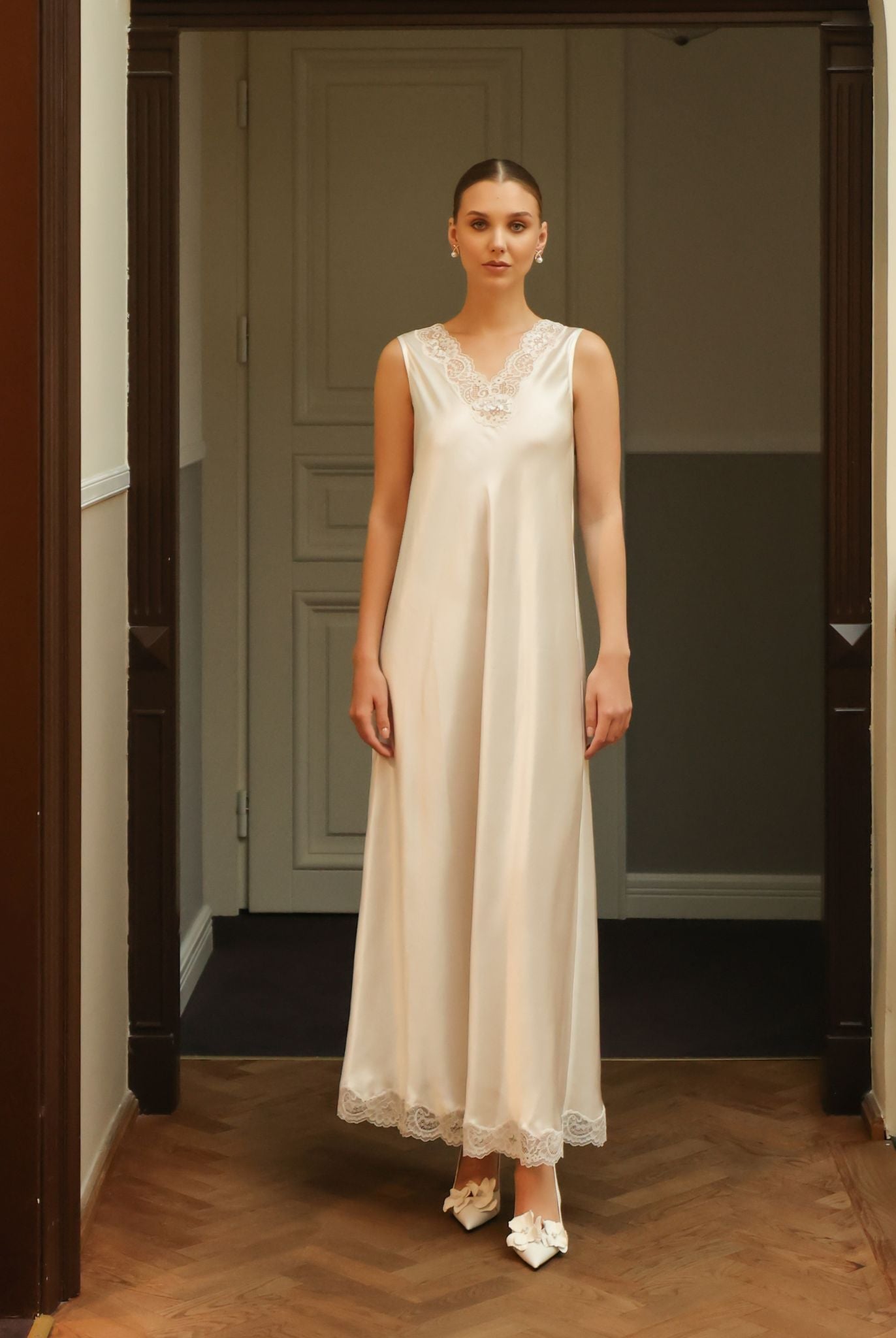 Front view of the floor-length white nightdress, highlighting the relaxed silhouette and high-quality mulberry silk.