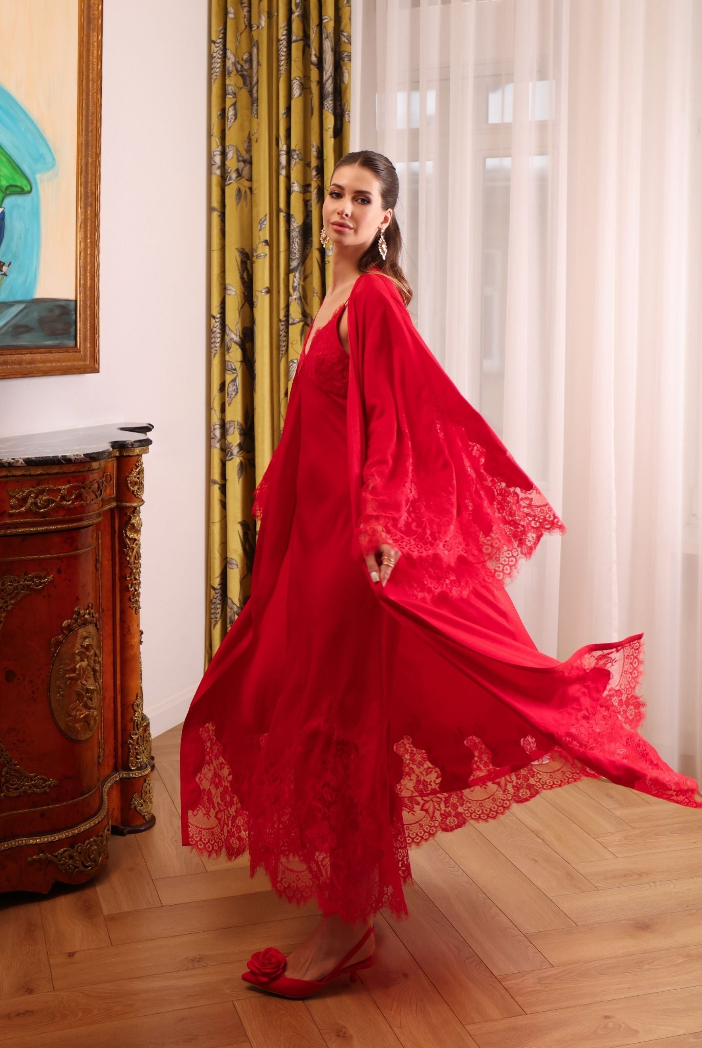 Action shot of the flowing robe, capturing the light and cool feel of the fabric during a dramatic movement.