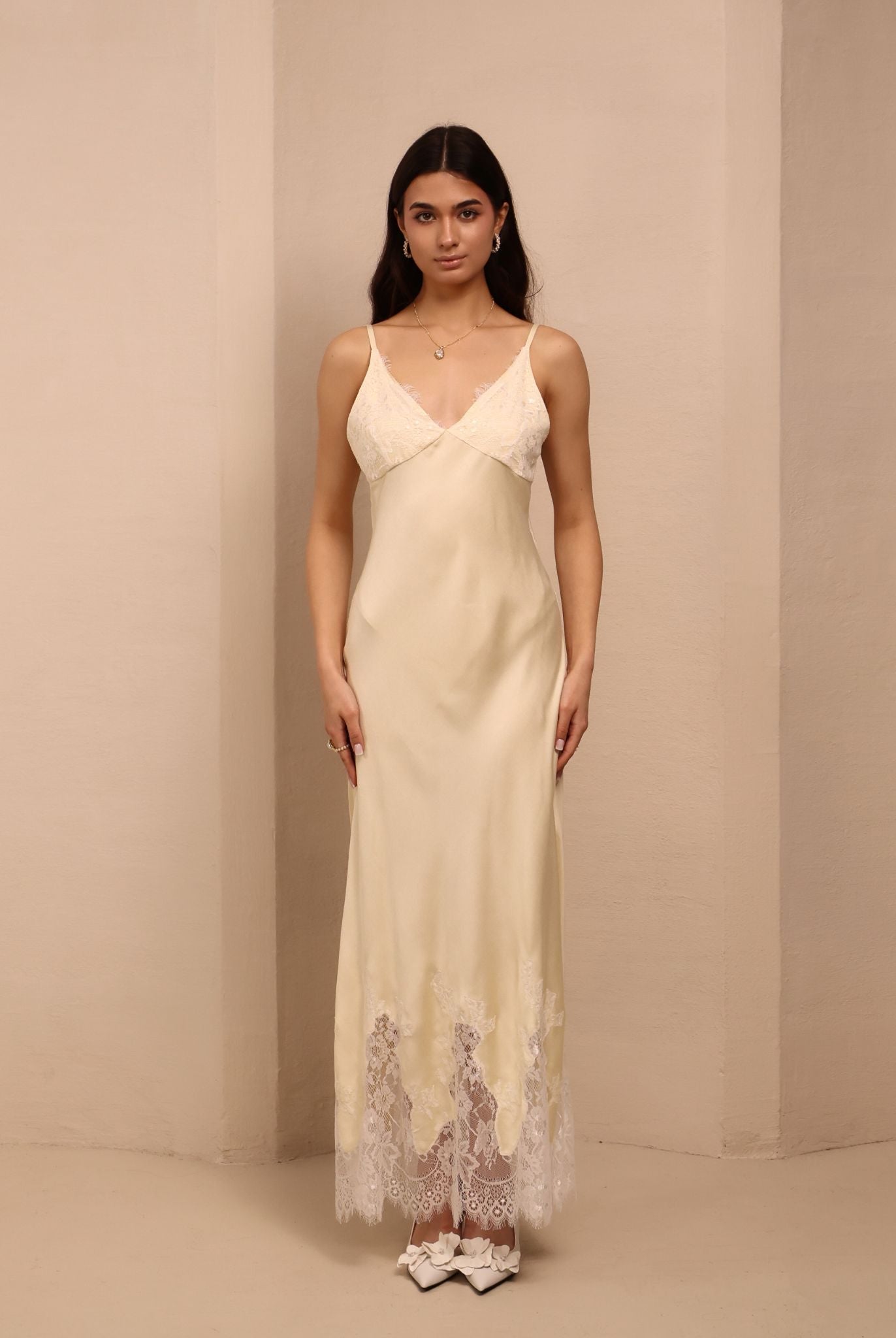 Frontal view of the nightdress, featuring delicate lace that trims the cups and the bottom edge for a fine touch.