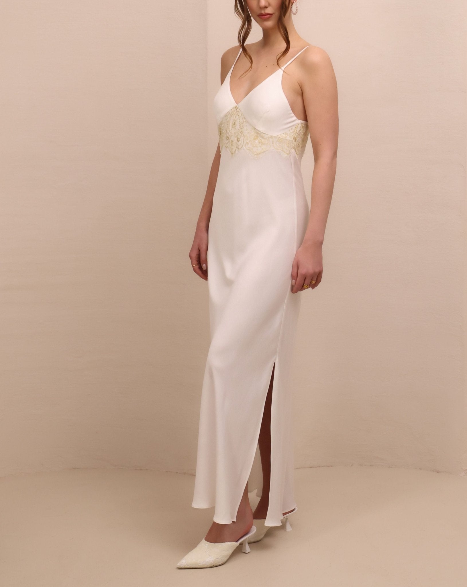 Side perspective of the nightdress, highlighting the subtle slit designed for movement and a soft, feminine fit.