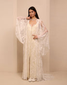 A posed view of the Robe and Nightgown Set with one hand on the waist and the other near the neck.