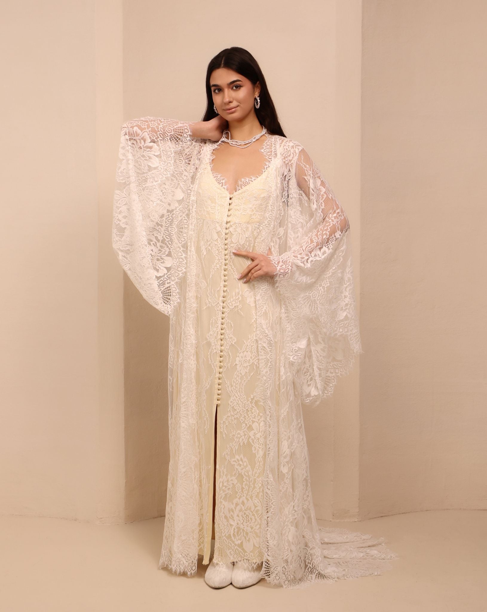 A posed view of the Robe and Nightgown Set with one hand on the waist and the other near the neck.