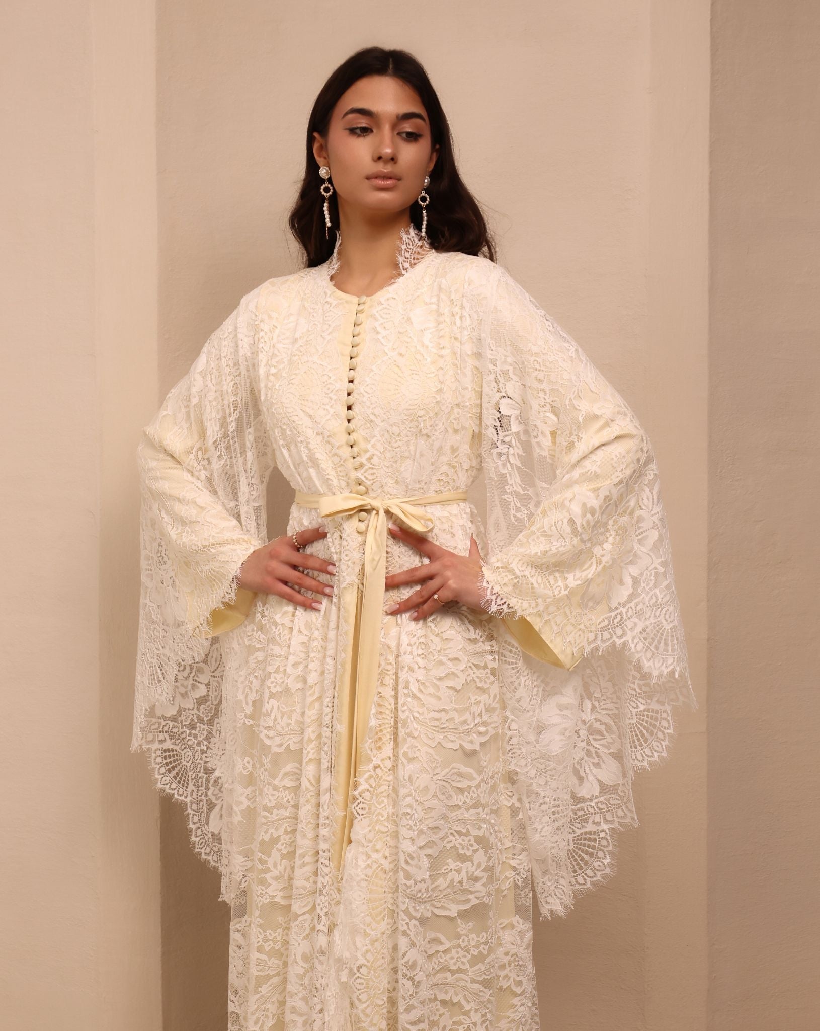 A mid-length shot of the attire, capturing the poetic movement and timeless detail of the lightweight fabric.