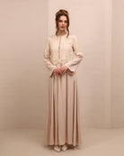 Frontal view of the nightgown, featuring a high neckline, long sleeves, and small buttons covered in fabric.