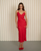 Front view of the long red nightdress, highlighting the fluid drape of the fabric and the elegant silhouette.