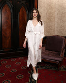 A full-length view of the Robe and Nightgown Set in motion, showcasing the sheer lace and fluid bell sleeves.